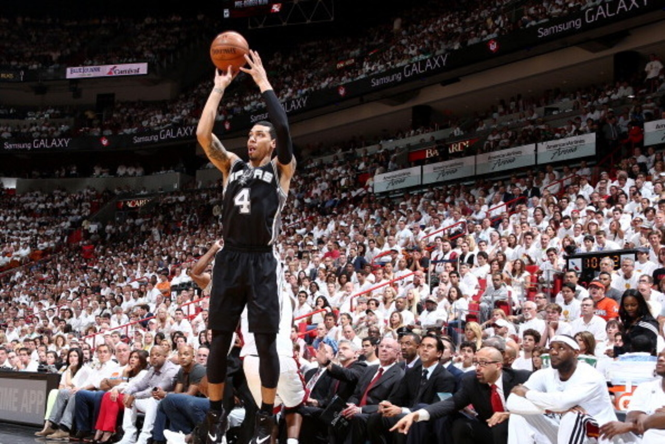 MIAMI, FL - JUNE 12: Miami Heat players watch as Danny Green #4 of the San Antonio Spurs shoots a three pointer during Game Four of the 2014 NBA Finals at American Airlines Arena in Miami, Florida on June 12, 2014.  NOTE TO USER: User expressly acknowledg