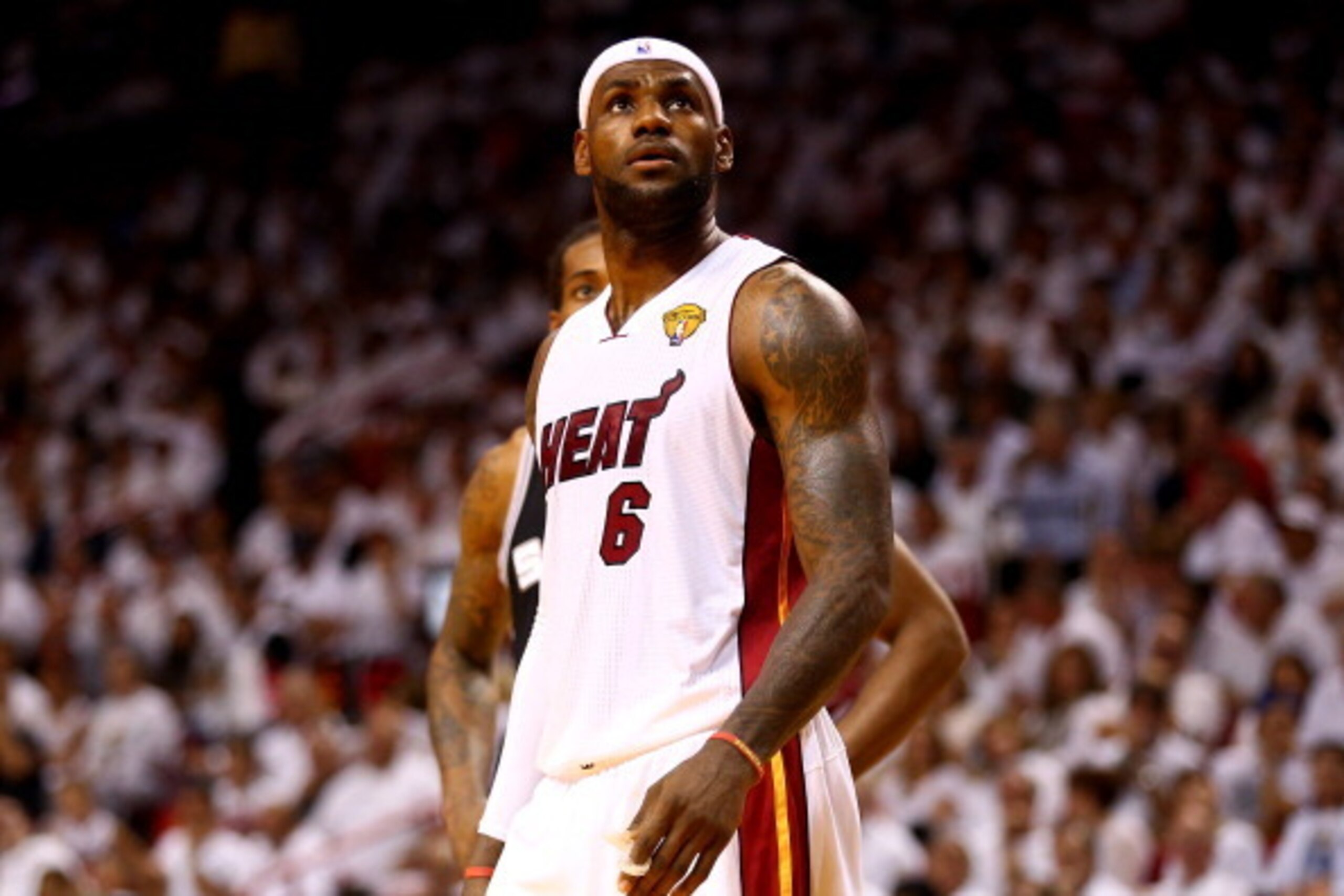 MIAMI, FL - JUNE 12:  LeBron James #6 of the Miami Heat looks on against the San Antonio Spurs during Game Four of the 2014 NBA Finals at American Airlines Arena on June 12, 2014 in Miami, Florida. NOTE TO USER: User expressly acknowledges and agrees that