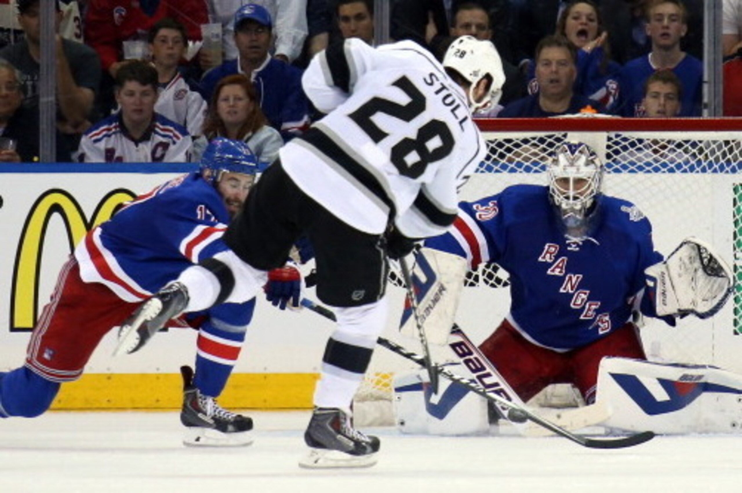 NEW YORK, NY - JUNE 11:  Jarret Stoll #28 of the Los Angeles Kings shoots on Henrik Lundqvist #30 of the New York Rangers with John Moore #17 of the New York Rangers defending during the second period of Game Four of the 2014 NHL Stanley Cup Final at Madi