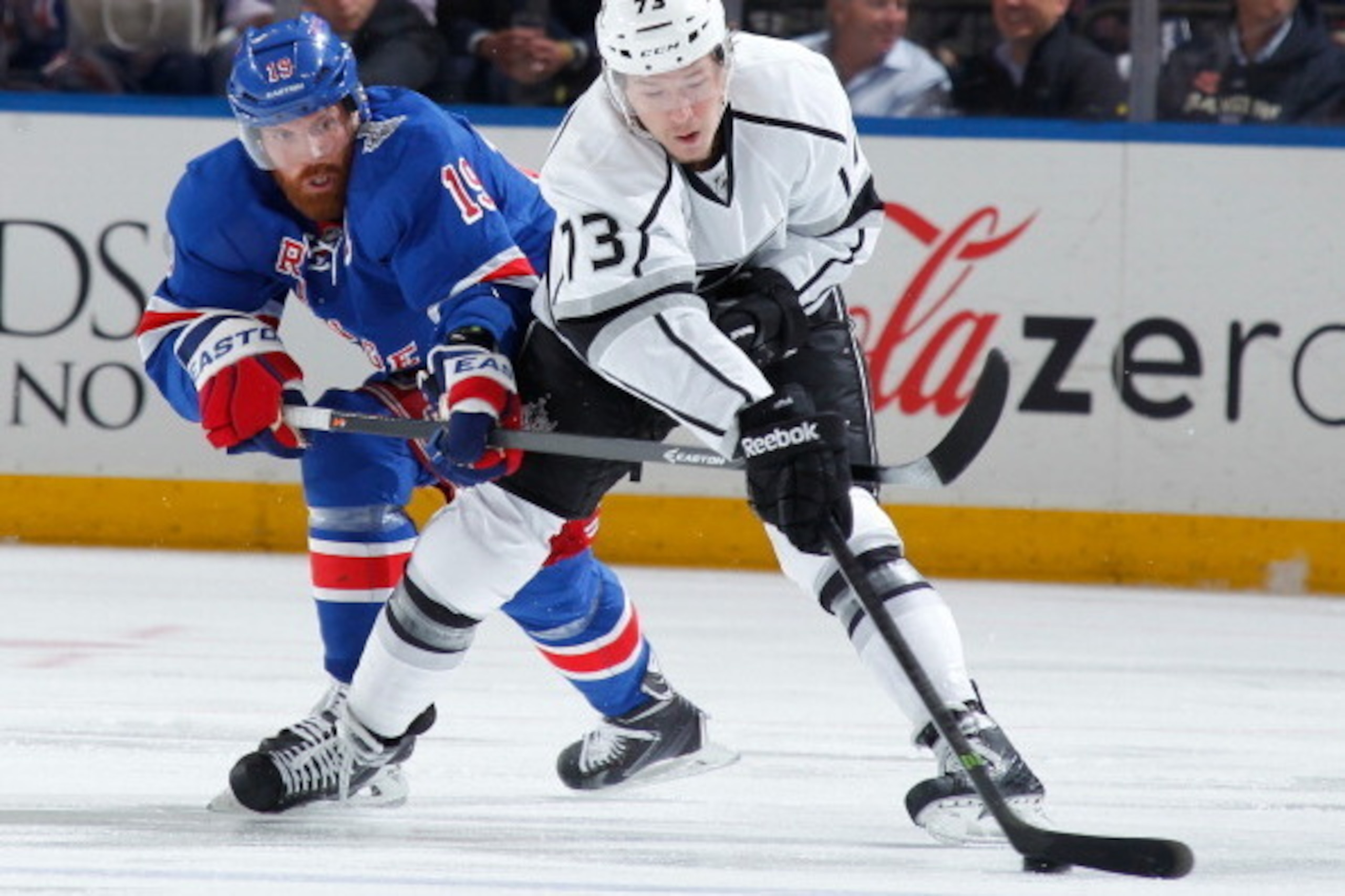 NEW YORK, NY - JUNE 11:  Brad Richards #19 of the New York Rangers battles for the puck against Tyler Toffoli #73 of the Los Angeles Kings during Game Four of the 2014 NHL Stanley Cup Final at Madison Square Garden on June 11, 2014 in New York City. (Phot