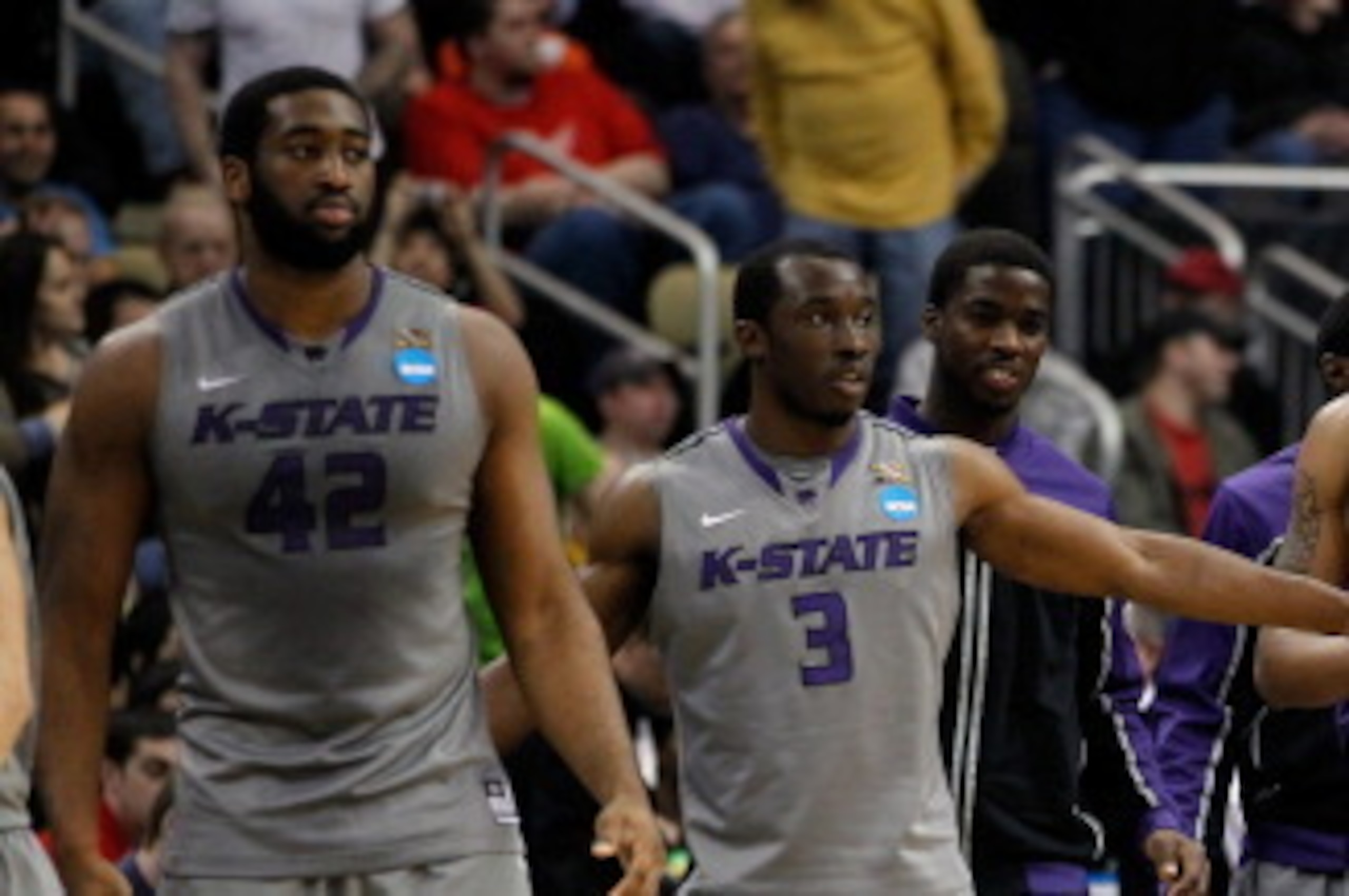 PITTSBURGH, PA - MARCH 15:  Martavious Irving #3 of the Kansas State Wildcats celebrates with teammates Shane Southwell #1 and Jamar Samuels #32 after defeating the Southern Miss Golden Eagles during the second round of the 2012 NCAA Men's Basketball Tour