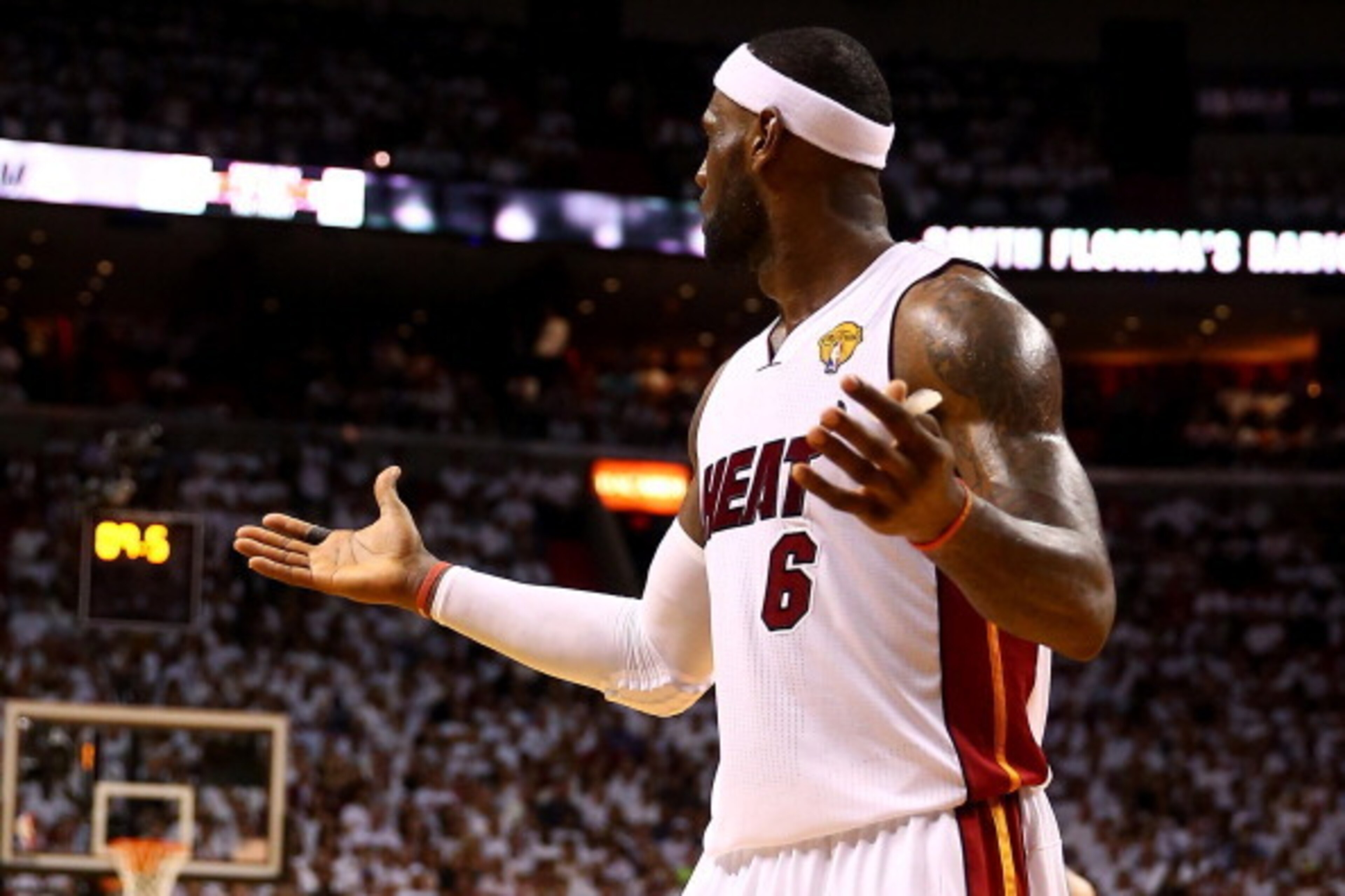 MIAMI, FL - JUNE 12: LeBron James #6 of the Miami Heat reacts against the San Antonio Spurs during Game Four of the 2014 NBA Finals at American Airlines Arena on June 12, 2014 in Miami, Florida. NOTE TO USER: User expressly acknowledges and agrees that, b