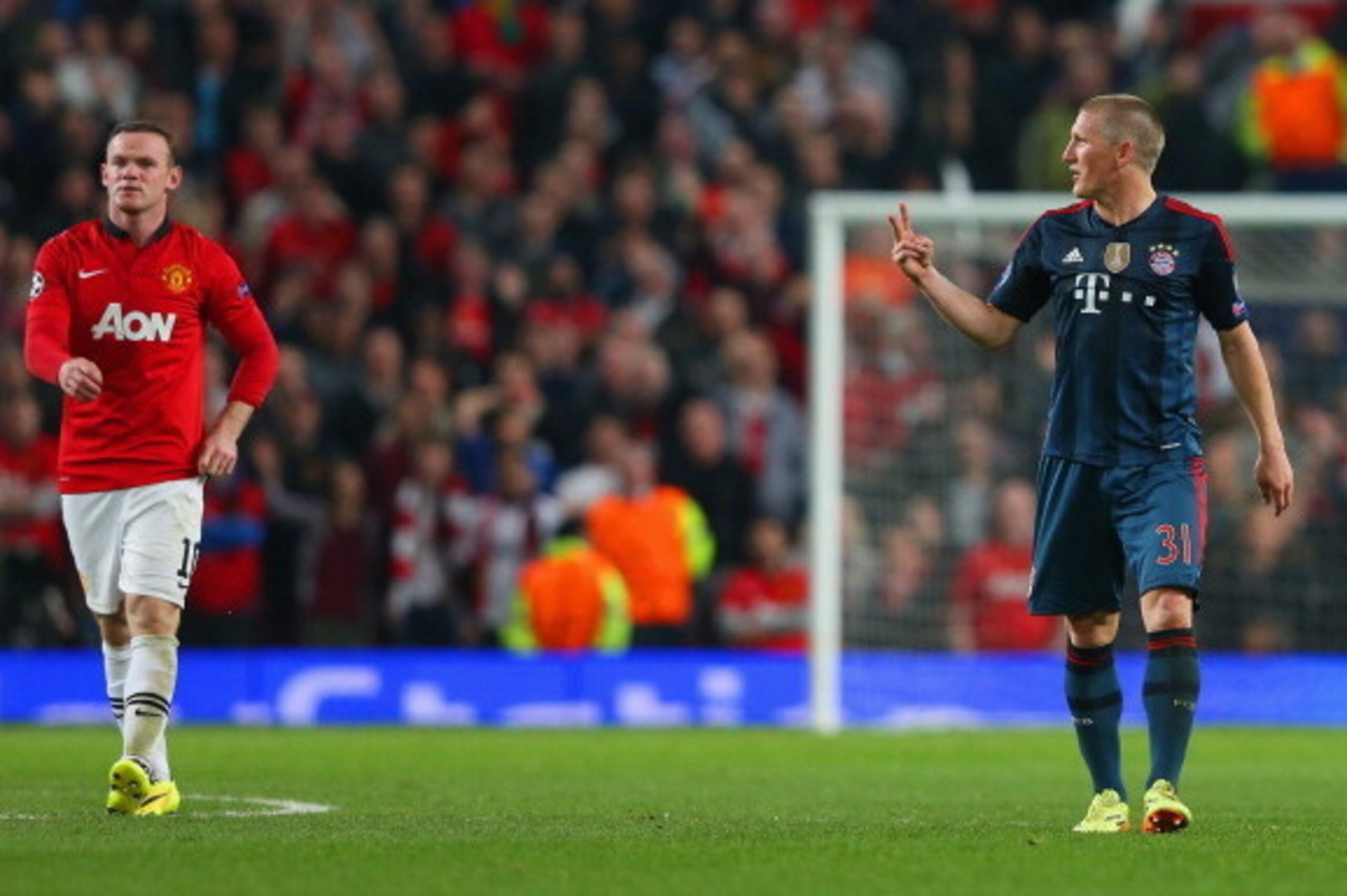 MANCHESTER, ENGLAND - APRIL 01:  Bastian Schweinsteiger of Bayern Muenchen argues with Wayne Rooney of Manchester United after he received a red card during the UEFA Champions League Quarter Final first leg match between Manchester United and FC Bayern Mu