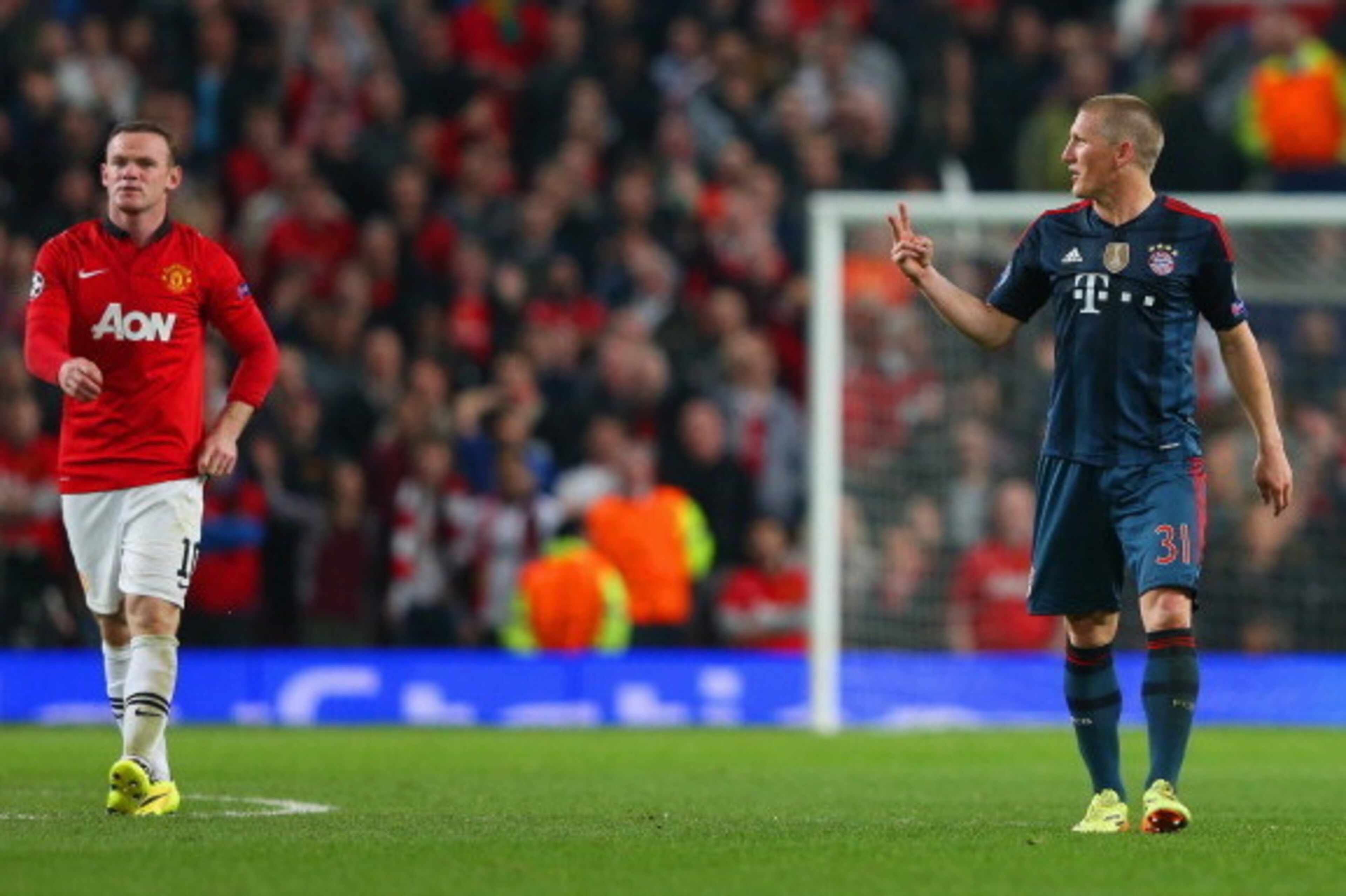 MANCHESTER, ENGLAND - APRIL 01:  Bastian Schweinsteiger of Bayern Muenchen argues with Wayne Rooney of Manchester United after he received a red card during the UEFA Champions League Quarter Final first leg match between Manchester United and FC Bayern Mu
