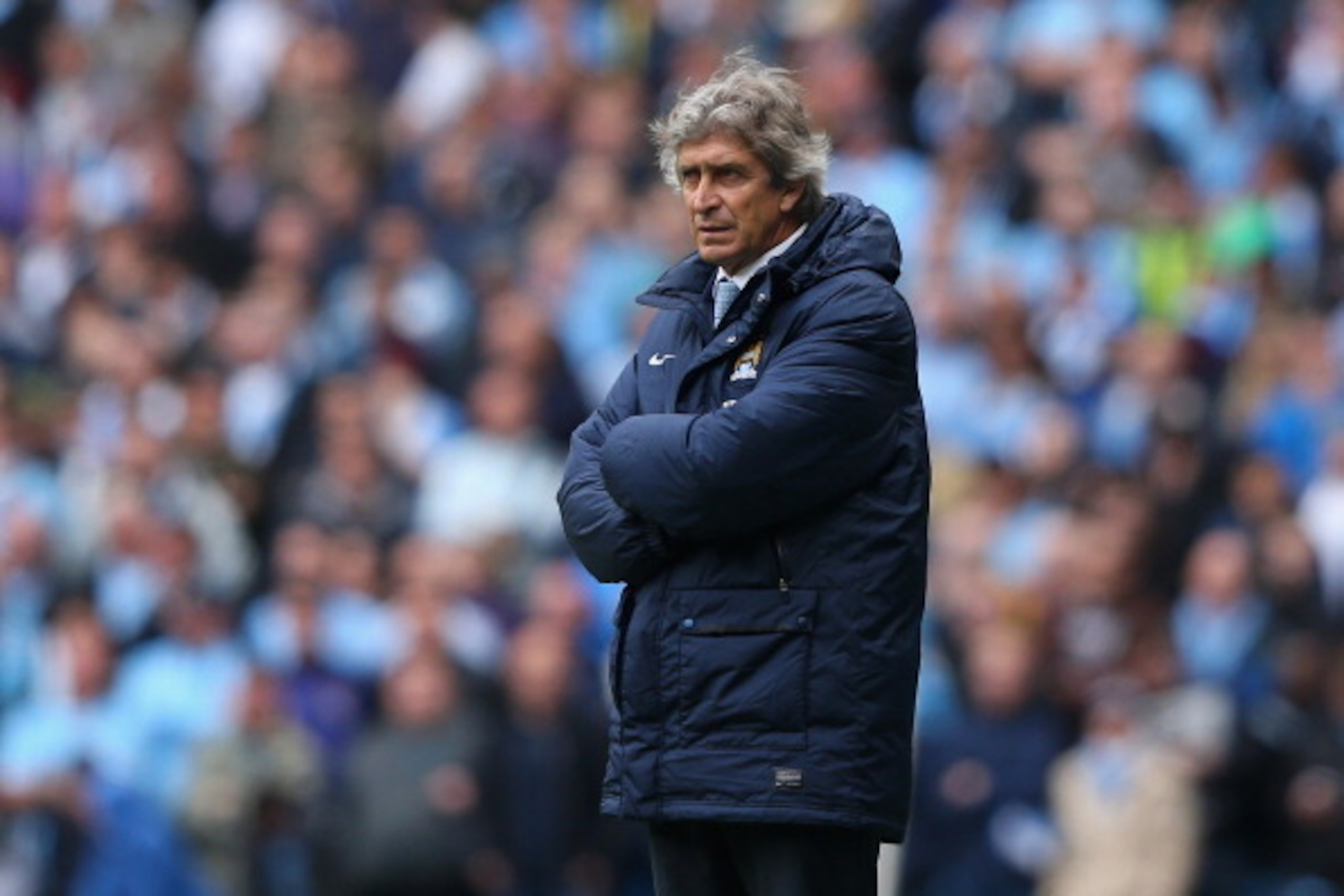 MANCHESTER, ENGLAND - MAY 11:  The Manchester City Manager Manuel Pellegrini looks on during the Barclays Premier League match between Manchester City and West Ham United at the Etihad Stadium on May 11, 2014 in Manchester, England.  (Photo by Alex Livese