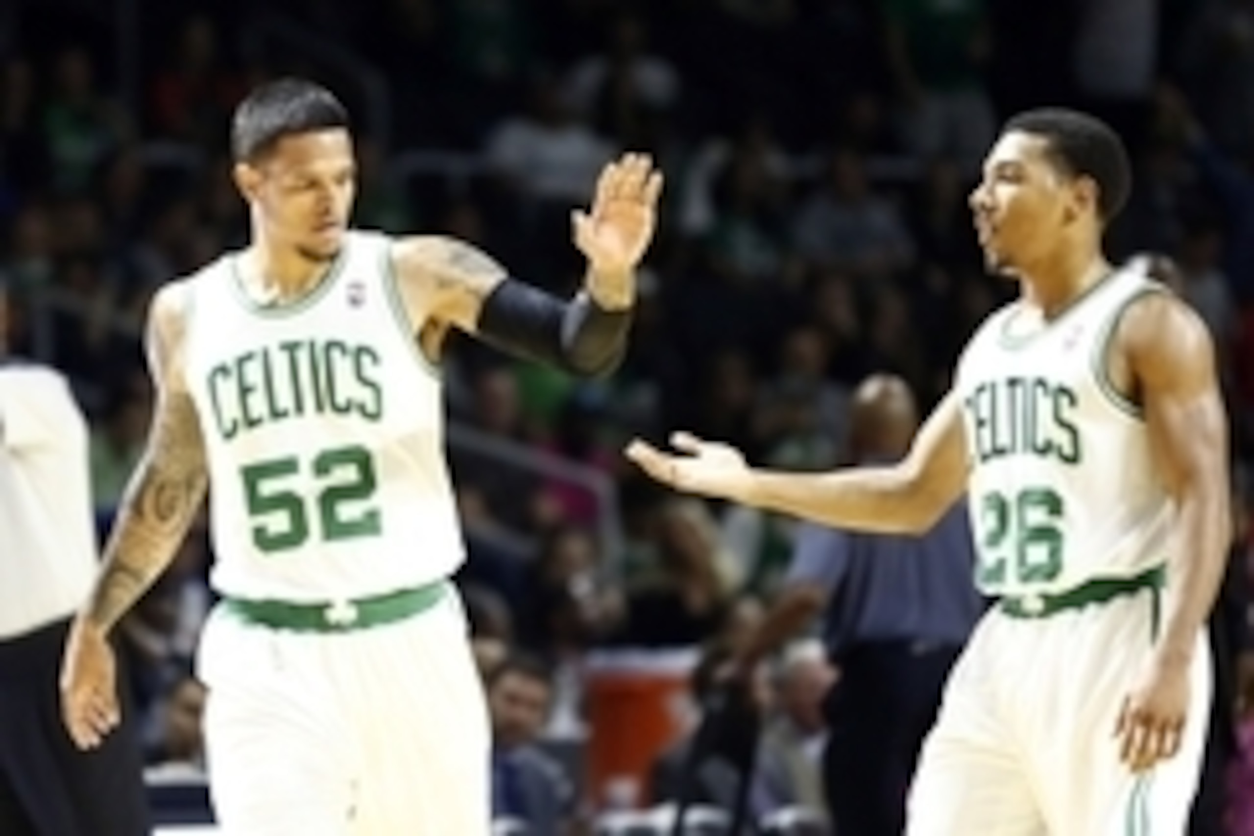 Oct 9, 2013; Providence, RI, USA; Boston Celtics guard Chris Babb (52) and point guard Phil Pressey (26) celebrate against the New York Knicks during the second half at Dunkin Donuts Center. Mandatory Credit: Mark L. Baer-USA TODAY Sports