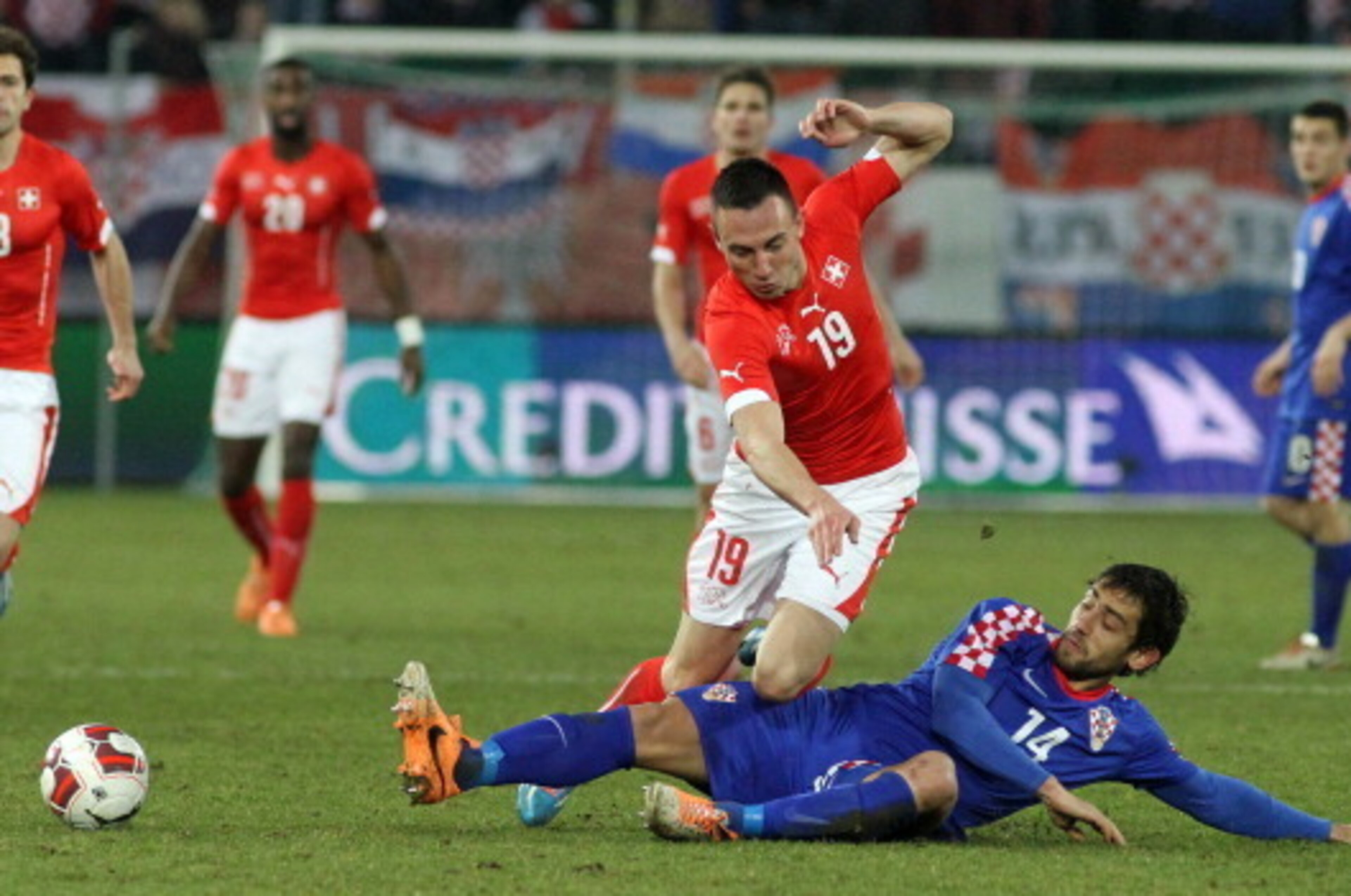 ST GALLEN, SWITZERLAND - MARCH 05: Mate Males of Croatia (R) challenges Josip Drmic of Switzerland (L) during the international friendly match between Switzerland and Croatia at the AFG Arena on March 5, 2014 in St Gallen, Switzerland.  (Photo by Marc Eic