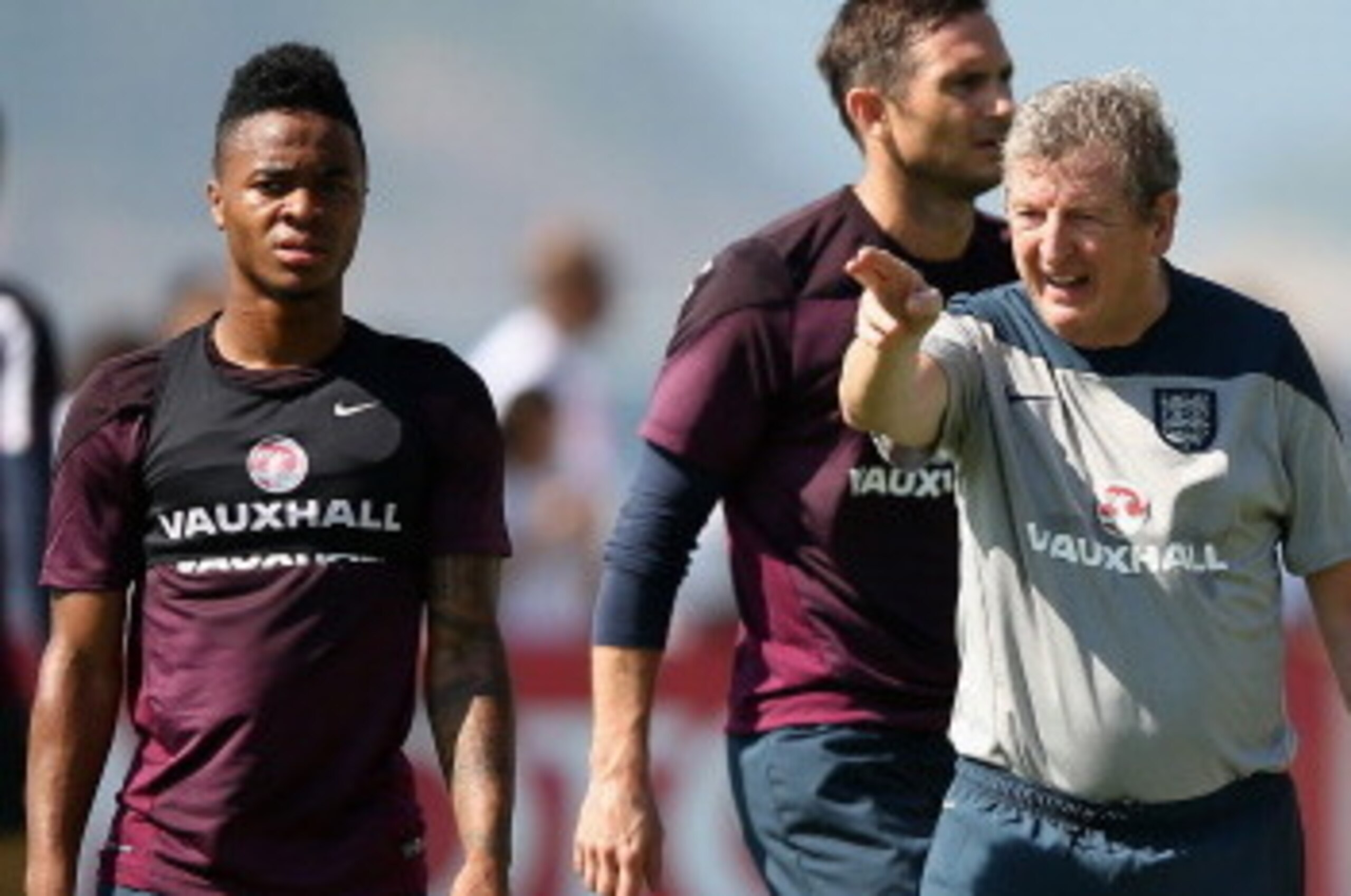 RIO DE JANEIRO, BRAZIL - JUNE 09: Roy Hodgson, manager of England (R) talks with Raheem Sterling of England during a training session at the Urca military base (Forte de Urca) training ground on June 9, 2014 in Rio de Janeiro, Brazil. (Photo by Richard RIO DE JANEIRO, BRAZIL - JUNE 09: Roy Hodgson, manager of England (R) talks with Raheem Sterling of England during a training session at the Urca military base (Forte de Urca) training ground on June 9, 2014 in Rio de Janeiro, Brazil. (Photo by Richard