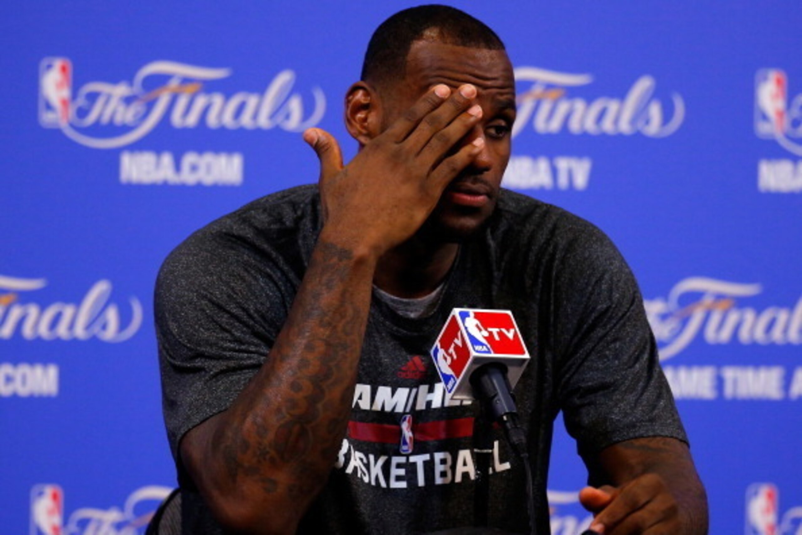 MIAMI, FL - JUNE 12: LeBron James #6 of the Miami Heat speaks to the media after losing 107-86 to the San Antonio Spurs in Game Four of the 2014 NBA Finals at American Airlines Arena on June 12, 2014 in Miami, Florida. NOTE TO USER: User expressly acknow MIAMI, FL - JUNE 12: LeBron James #6 of the Miami Heat speaks to the media after losing 107-86 to the San Antonio Spurs in Game Four of the 2014 NBA Finals at American Airlines Arena on June 12, 2014 in Miami, Florida. NOTE TO USER: User expressly acknow