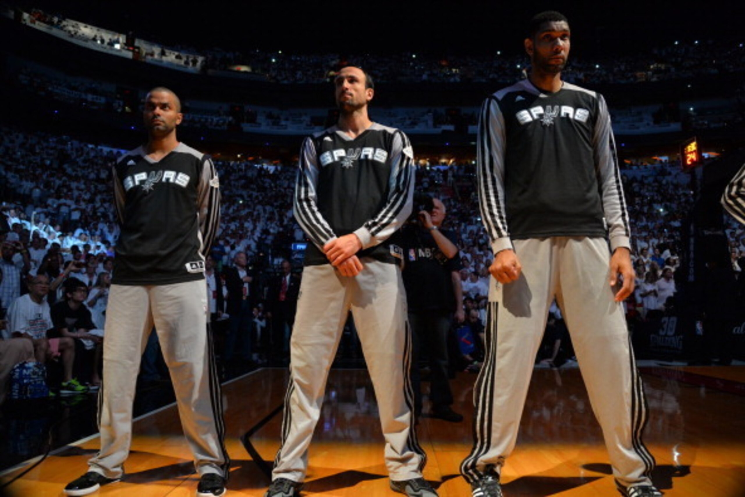 MIAMI, FL - JUNE 10: Tony Parker #9, Manu Ginobili #20, and Tim Duncan #21 of the San Antonio Spurs stand during the National Anthem before Game Three of the 2014 NBA Finals against the Miami Heat on June 10, 2014 at American Airlines Arena in Miami, Flor MIAMI, FL - JUNE 10: Tony Parker #9, Manu Ginobili #20, and Tim Duncan #21 of the San Antonio Spurs stand during the National Anthem before Game Three of the 2014 NBA Finals against the Miami Heat on June 10, 2014 at American Airlines Arena in Miami, Flor