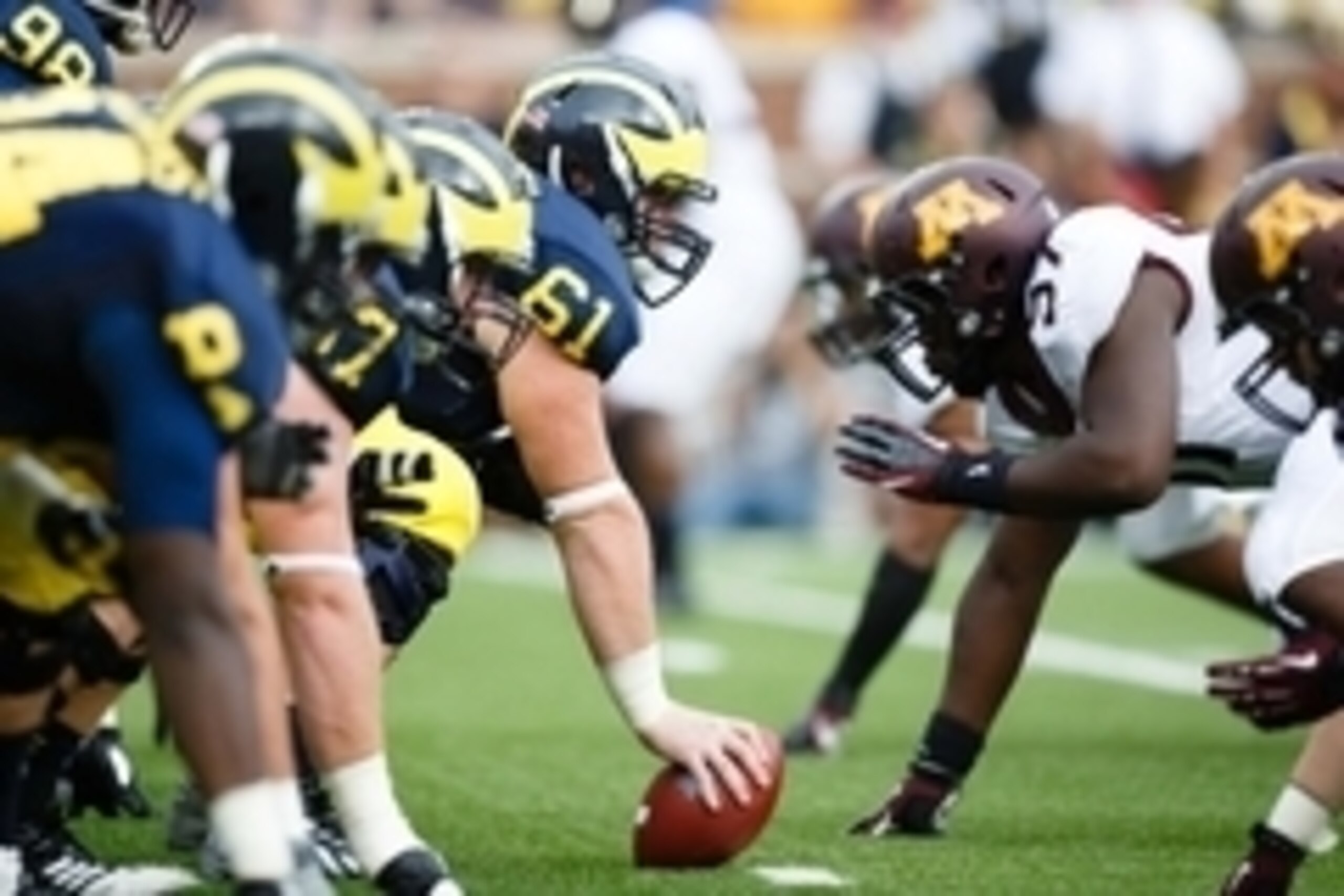 Oct 5, 2013; Ann Arbor, MI, USA; Michigan Wolverines offensive linesman Graham Glasgow (61) gets set against the Minnesota Golden Gophers at Michigan Stadium. Mandatory Credit: Rick Osentoski-USA TODAY Sports