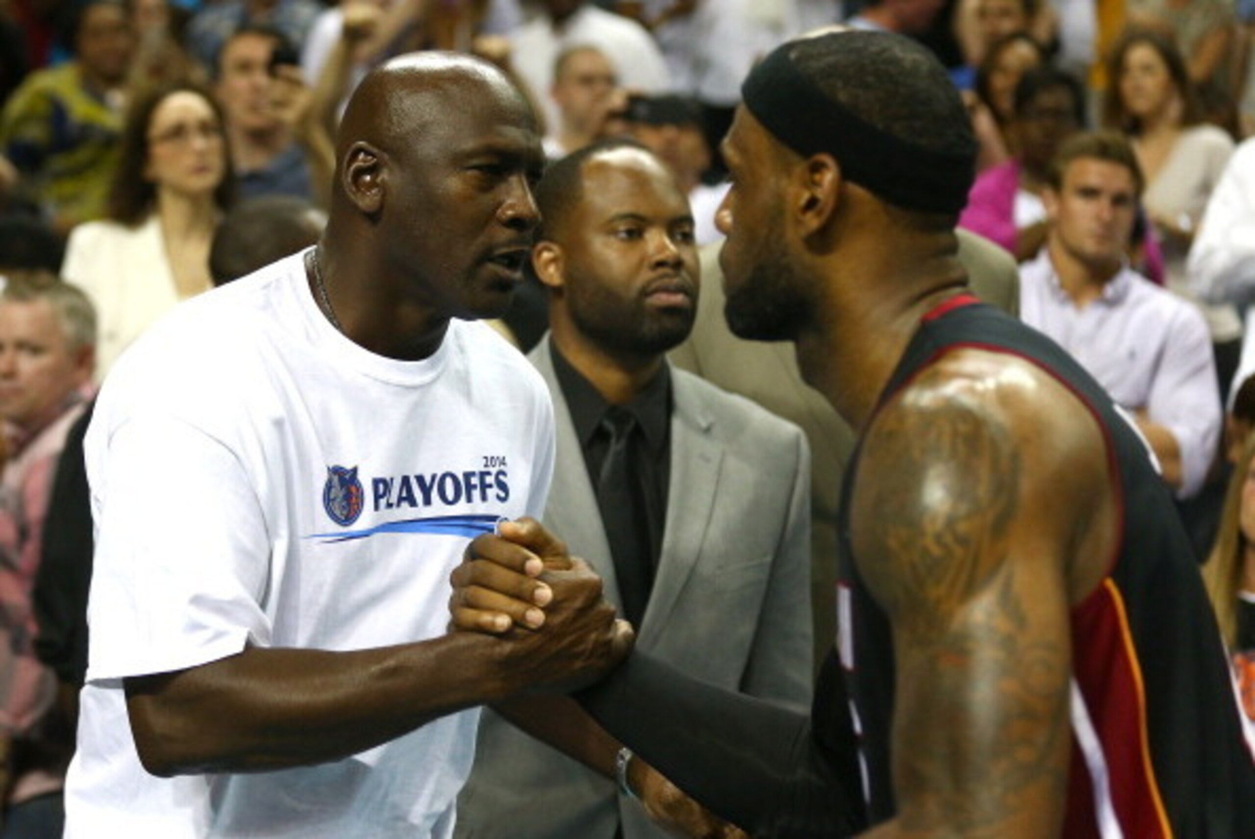 CHARLOTTE, NC - APRIL 28:  LeBron James #6 of the Miami Heat hugs Michael Jordan after defeating the Charlotte Bobcats 109-98 in Game Four of the Eastern Conference Quarterfinals during the 2014 NBA Playoffs at Time Warner Cable Arena on April 28, 2014 in