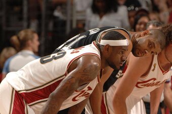 CLEVELAND - JUNE 14:  Tim Duncan #21 of the San Antonio Spurs matches up against LeBron James #23 of the Cleveland Cavaliers in Game Four of the NBA Finals at the Quicken Loans Arena on June 14, 2007 in Cleveland, Ohio. NOTE TO USER: User expressly acknow