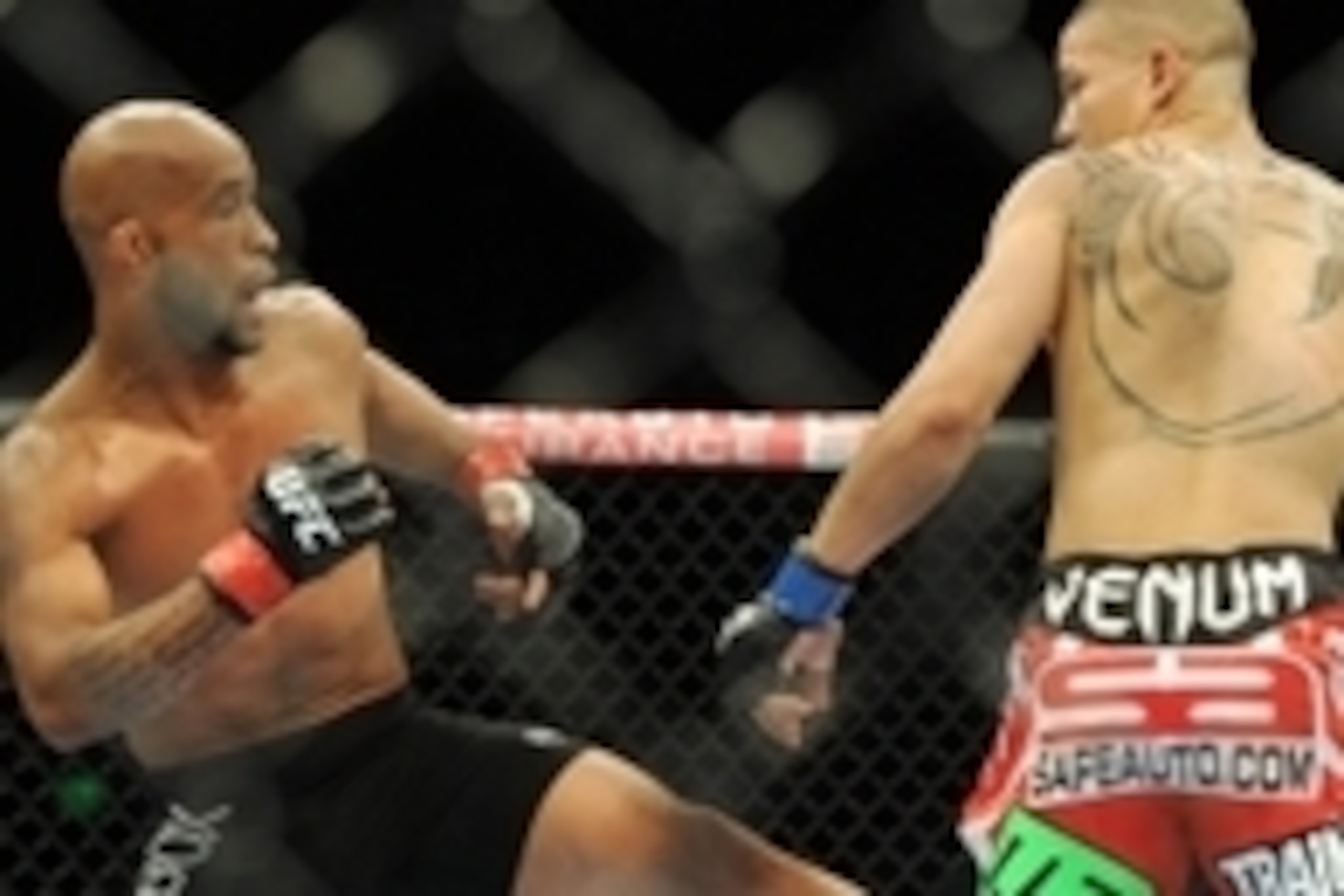 Jul 27, 2013; Seattle, WA, USA; Demetrious Johnson (red tape) kicks John Moraga (blue tape) during their welterweight bout at Key Arena. Johnson won by a tap out. Mandatory Credit: Jayne Kamin-Oncea-USA TODAY Sports Jul 27, 2013; Seattle, WA, USA; Demetrious Johnson (red tape) kicks John Moraga (blue tape) during their welterweight bout at Key Arena. Johnson won by a tap out. Mandatory Credit: Jayne Kamin-Oncea-USA TODAY Sports