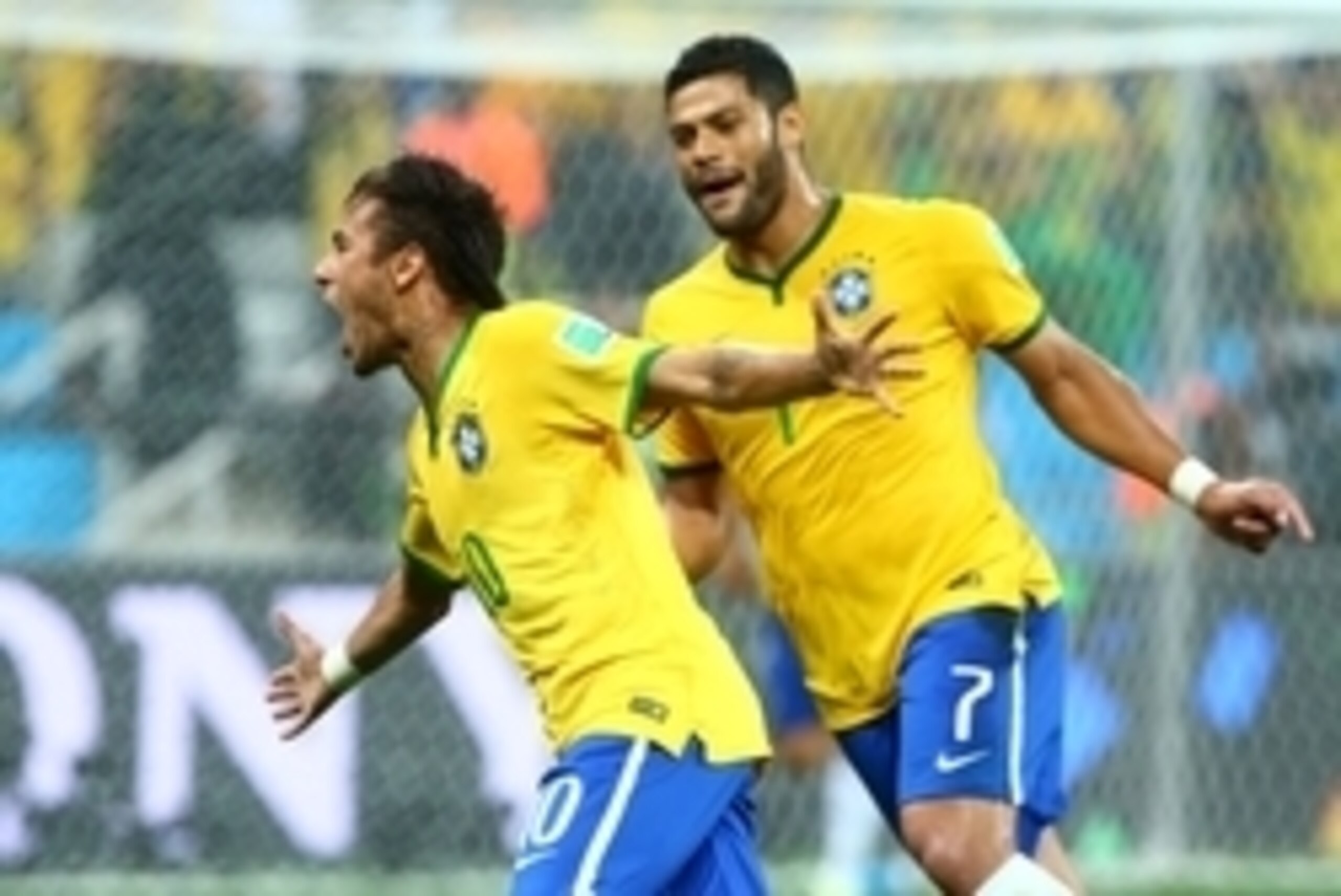 Jun 12, 2014; Sao Paulo, BRAZIL; Brazil forward Neymar (10) celebrates with teammate Hulk after scoring a goal against Croatia in the first half of the opening game of the 2014 World Cup at Arena Corinthians. Mandatory Credit: Mark J. Rebilas-USA TODAY Sp