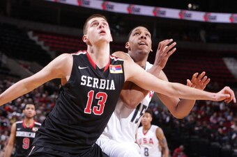 PORTLAND, OR - APRIL 12:  Nikola Jokic #13 of the World Team boxes out against the USA Team on April 12, 2014 at the Moda Center Arena in Portland, Oregon. NOTE TO USER: User expressly acknowledges and agrees that, by downloading and or using this photogr