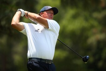 PINEHURST, NC - JUNE 13:  Phil Mickelson of the United States hits his tee shot on the second hole during the second round of the 114th U.S. Open at Pinehurst Resort & Country Club, Course No. 2 on June 13, 2014 in Pinehurst, North Carolina.  (Photo by St