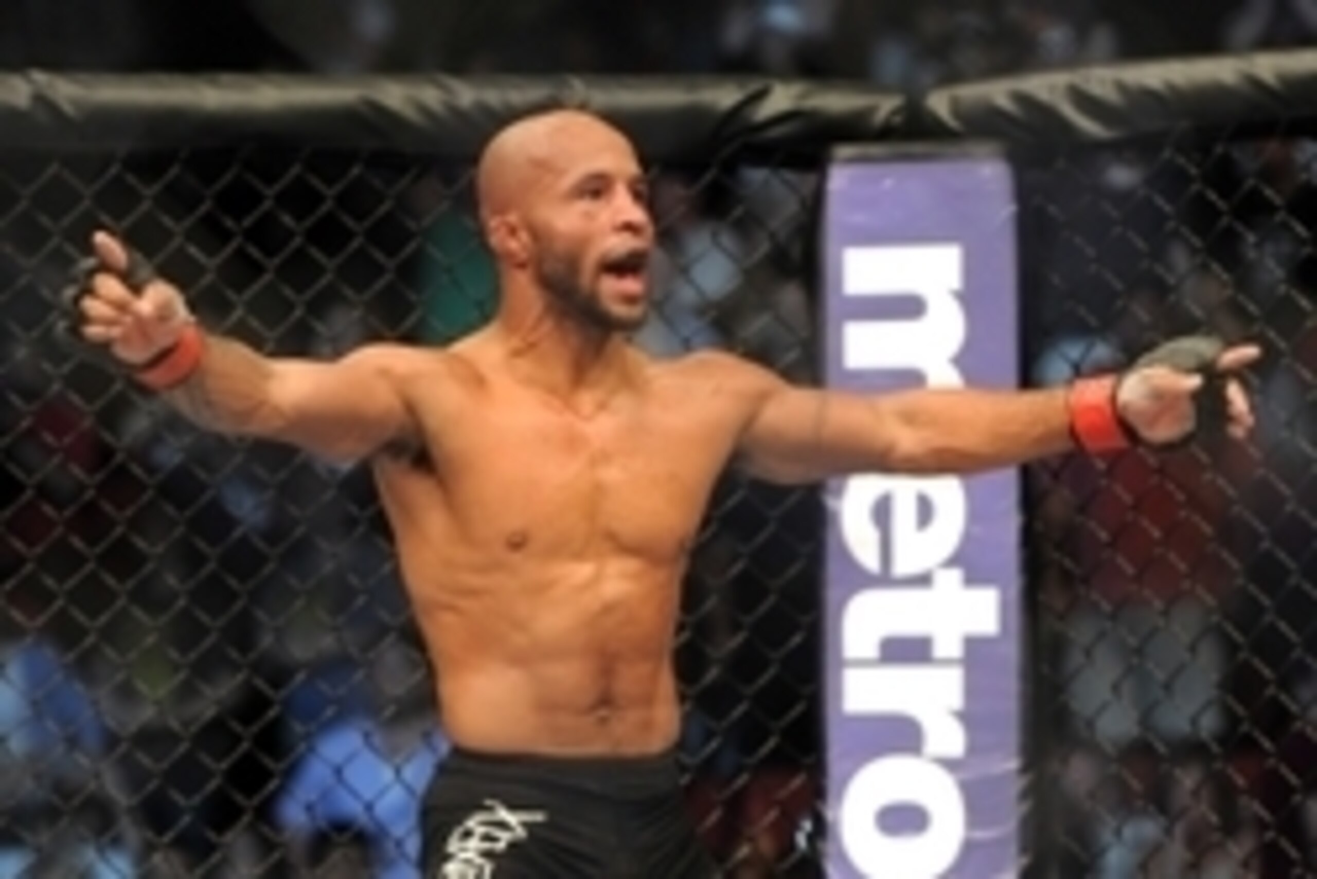 Jul 27, 2013; Seattle, WA, USA;  Demetrious Johnson celebrates his welterweight fight win over John Moraga (not pictured) at Key Arena. Johnson won by a Tap Out. Mandatory Credit: Jayne Kamin-Oncea-USA TODAY Sports