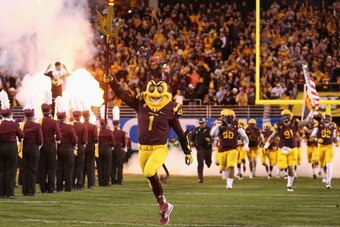 TEMPE, AZ - DECEMBER 07:  Arizona State Sun Devils mascot, Sparky runs out onto the field during the Pac 12 Championship game against the Arizona State Sun Devils at Sun Devil Stadium on December 7, 2013 in Tempe, Arizona. The Carindal defeated the Sun De