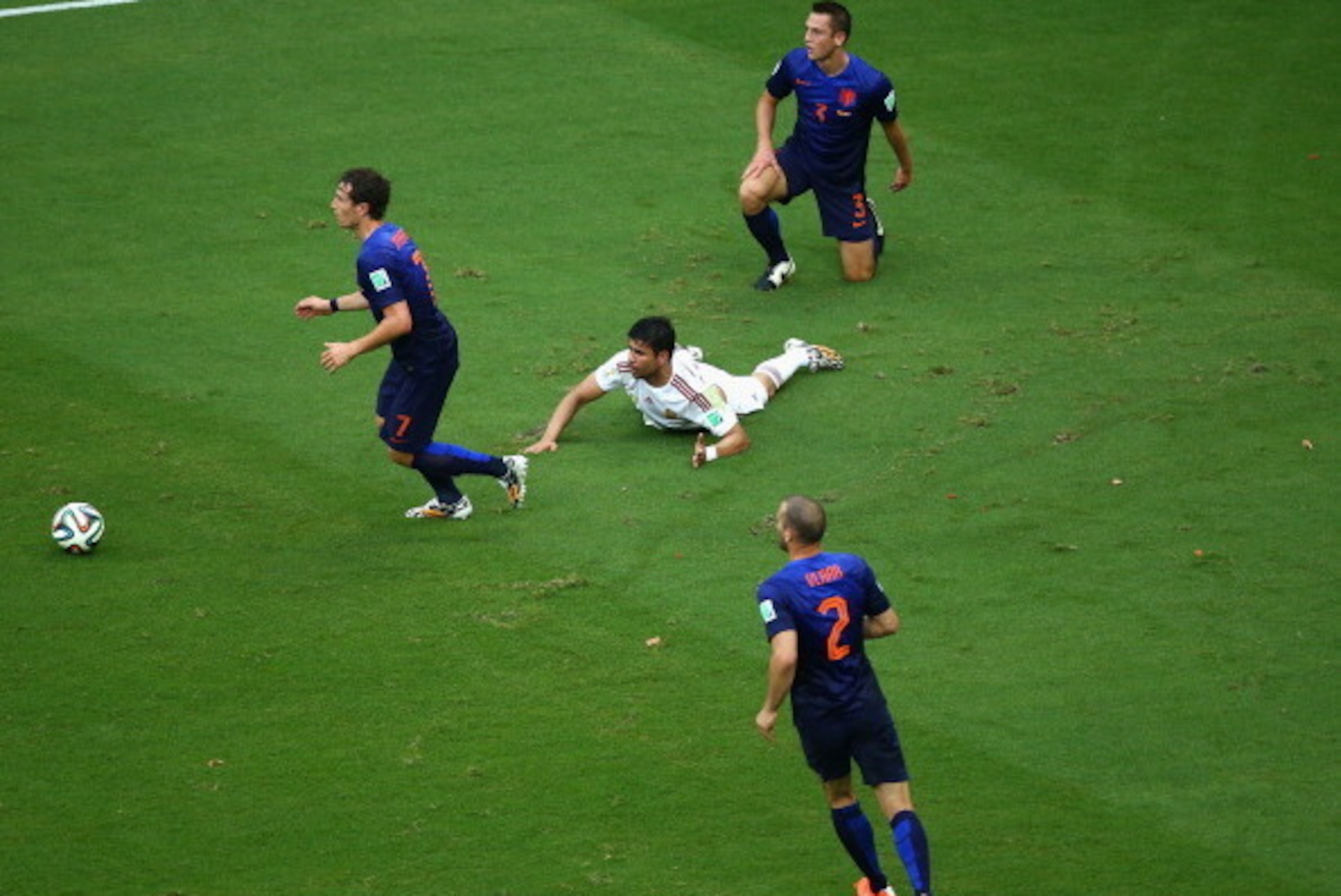 SALVADOR, BRAZIL - JUNE 13: Diego Costa of Spain lies on the field after being fould by Gerard Pique of Spain and awarded a penalty kick in the first half during the 2014 FIFA World Cup Brazil Group B match between Spain and Netherlands at Arena Fonte Nov