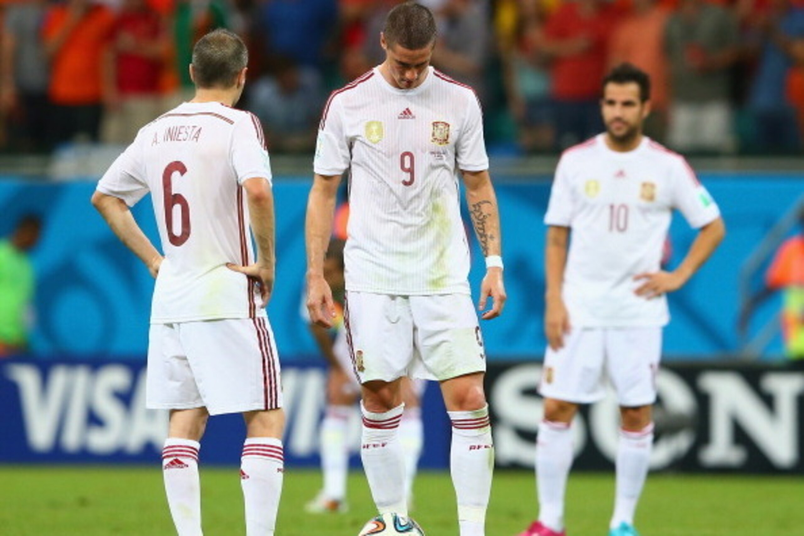 SALVADOR, BRAZIL - JUNE 13: (L - R) Andres Iniesta; Fernando Torres and Cesc Fabregas of Spain look dejected pduring the 2014 FIFA World Cup Brazil Group B match between Spain and Netherlands at Arena Fonte Nova on June 13, 2014 in Salvador, Brazil. (Ph SALVADOR, BRAZIL - JUNE 13: (L - R) Andres Iniesta; Fernando Torres and Cesc Fabregas of Spain look dejected pduring the 2014 FIFA World Cup Brazil Group B match between Spain and Netherlands at Arena Fonte Nova on June 13, 2014 in Salvador, Brazil. (Ph