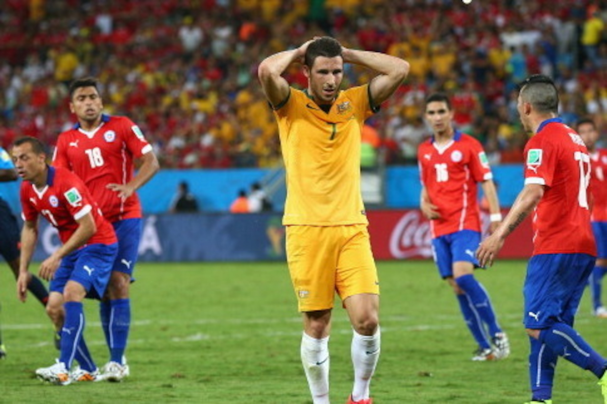 CUIABA, BRAZIL - JUNE 13: Mathew Leckie of Australia shows frustration during the 2014 FIFA World Cup Brazil Group B match between Chile and Australia at Arena Pantanal on June 13, 2014 in Cuiaba, Brazil.  (Photo by Cameron Spencer/Getty Images)