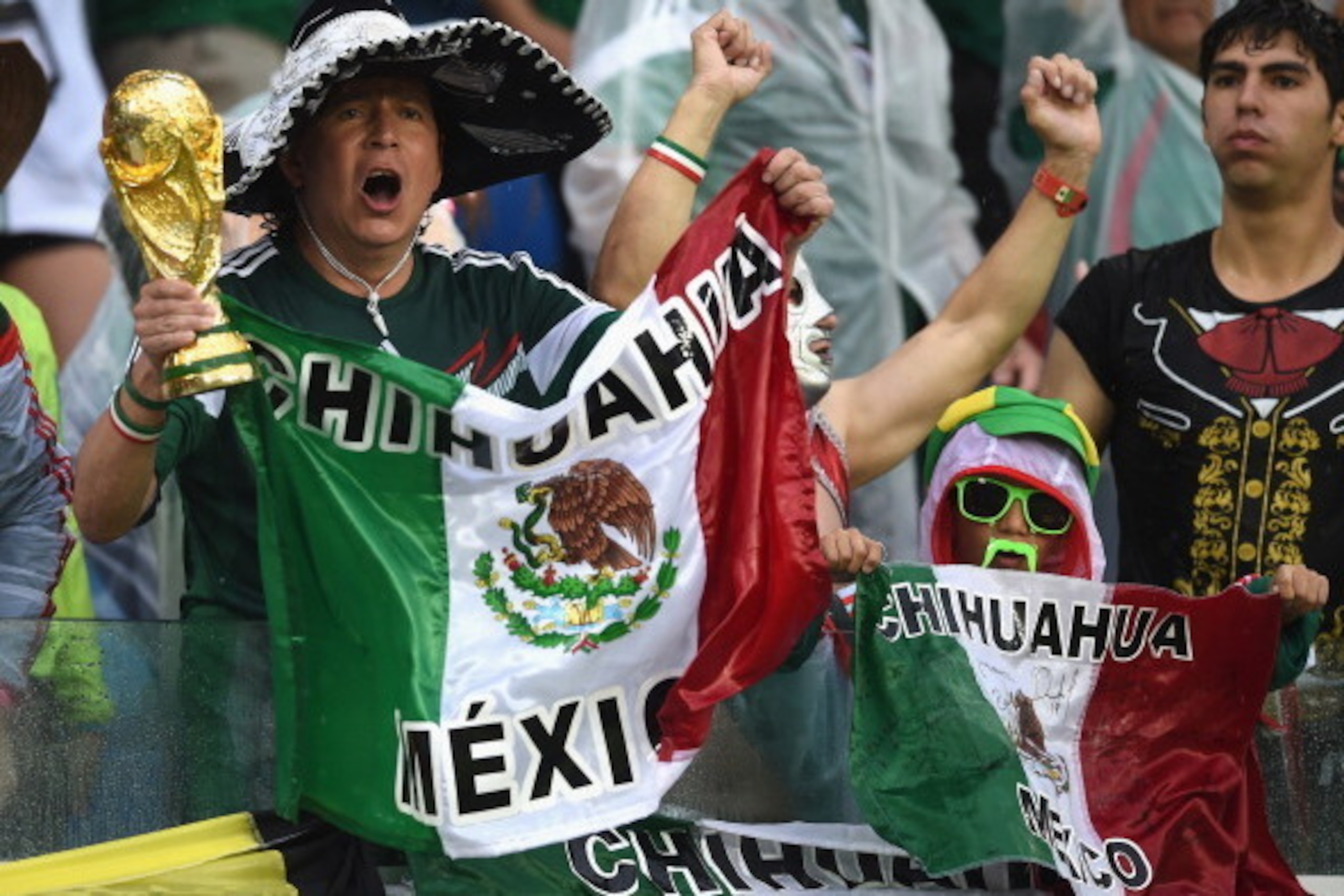 NATAL, BRAZIL - JUNE 13:  Mexico fans cheer during the 2014 FIFA World Cup Brazil Group A match between Mexico and Cameroon at Estadio das Dunas on June 13, 2014 in Natal, Brazil.  (Photo by Matthias Hangst/Getty Images)