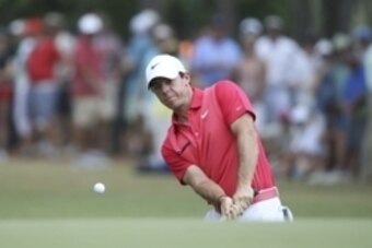 Jun 13, 2014; Pinehurst, NC, USA; Rory McIlroy chips onto the 15th green during the second round of the 2014 U.S. Open golf tournament at Pinehurst Resort Country Club - #2 Course. Mandatory Credit: Jason Getz-USA TODAY Sports
