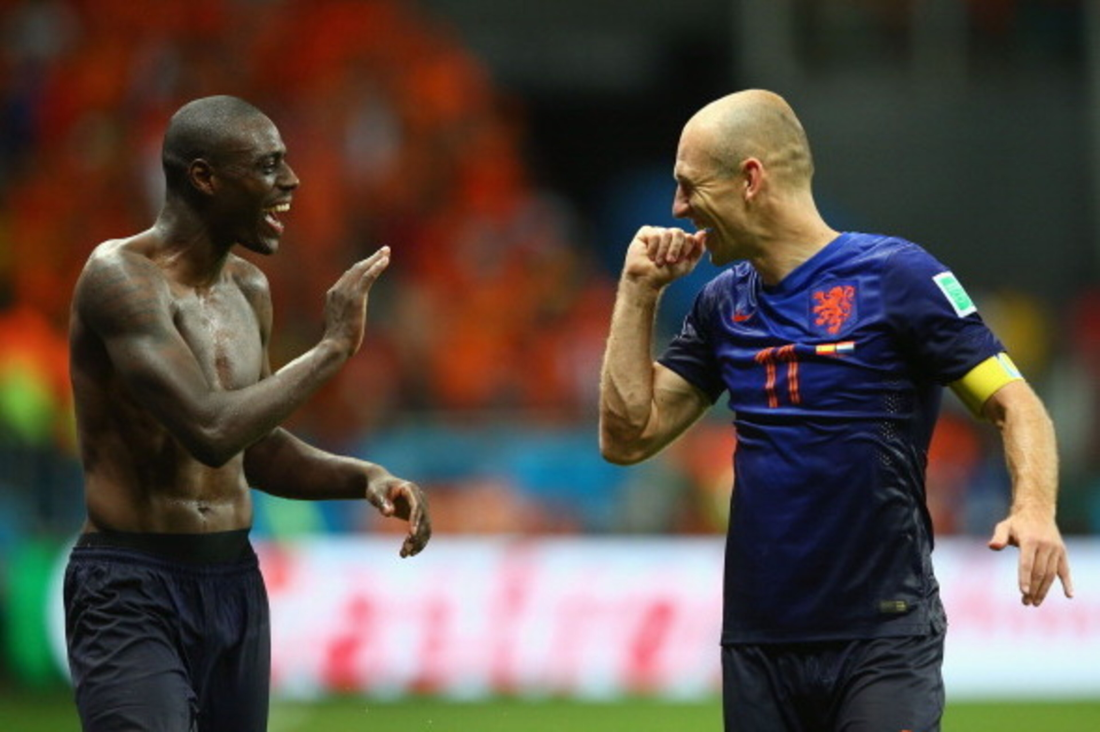 SALVADOR, BRAZIL - JUNE 13:  Bruno Martins Indi (L) and Arjen Robben of the Netherlands celebrate victory after the 2014 FIFA World Cup Brazil Group B match between Spain and Netherlands at Arena Fonte Nova on June 13, 2014 in Salvador, Brazil.  (Photo by