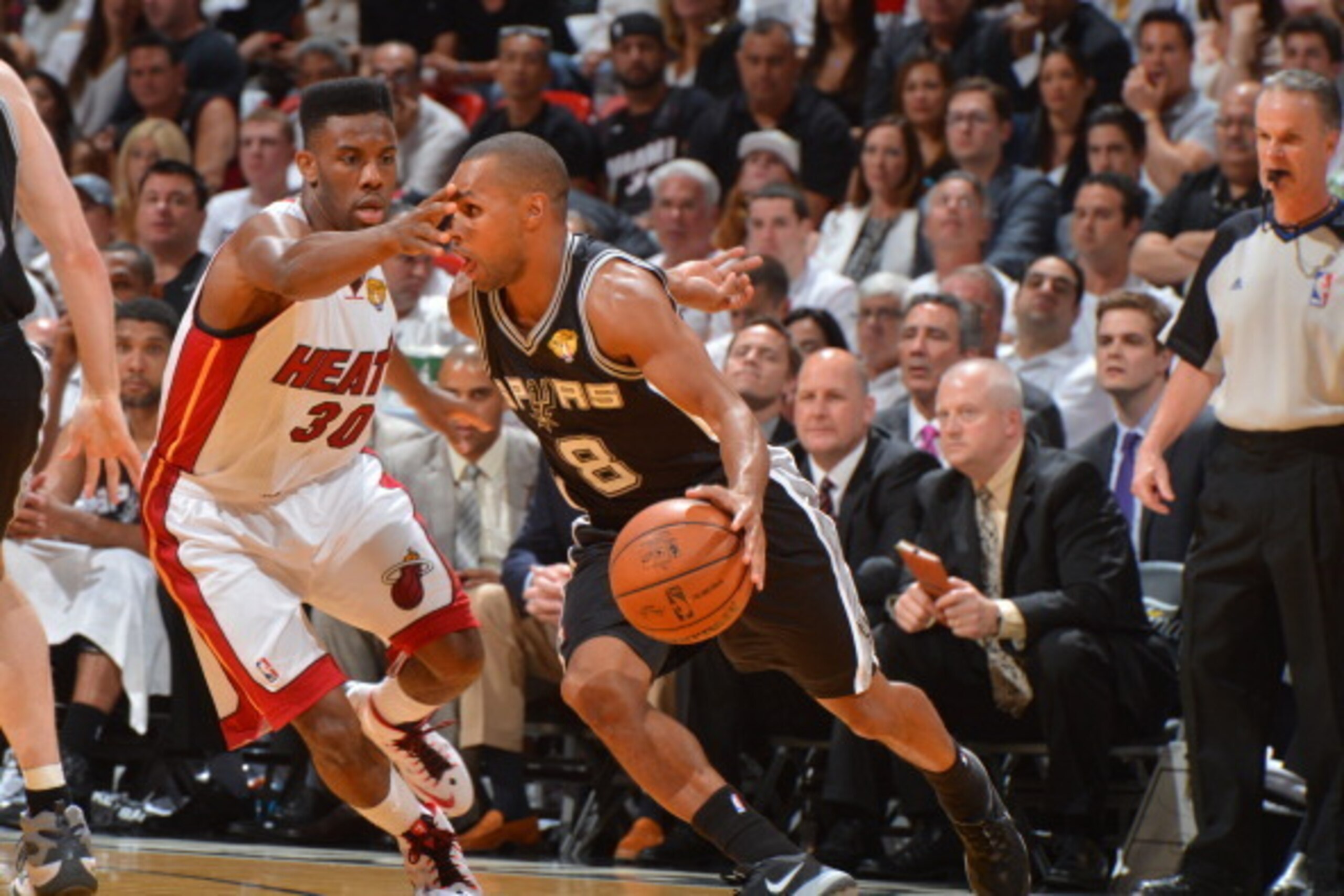 MIAMI, FL - JUNE 12: Patty Mills #8 of the San Antonio Spurs drives to the basket against the Miami Heat during Game Six of the 2014 NBA Finals on June 12, 2014 at American Airlines Arena in Miami, Florida. NOTE TO USER: User expressly acknowledges and ag