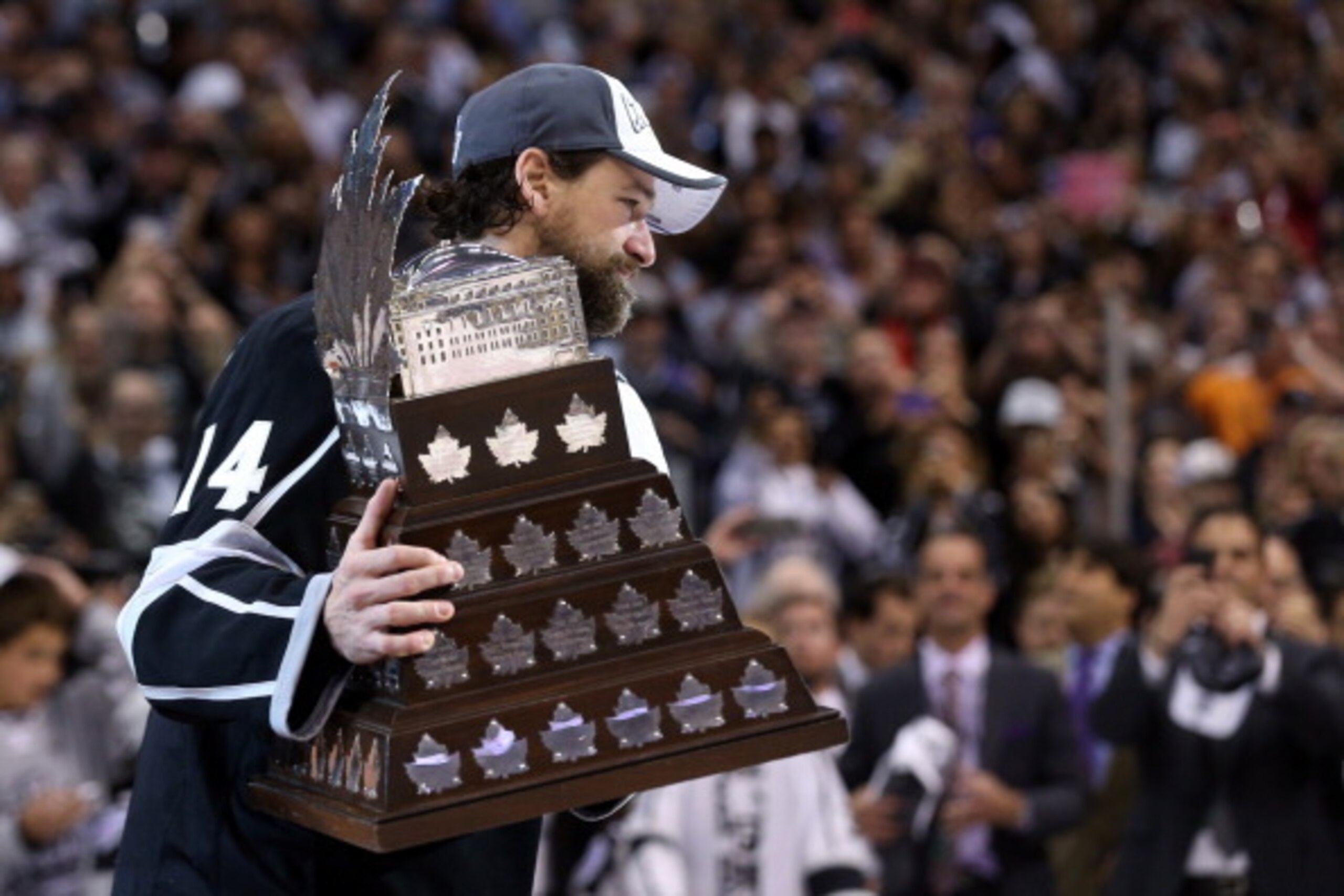 LOS ANGELES, CA - JUNE 13:  Justin Williams #14 of the Los Angeles Kings celebrates after winning the Conn Smythe Trophy after the Kings 3-2 double overtime victory against the New York Rangers in Game Five of the 2014 Stanley Cup Final at Staples Center 