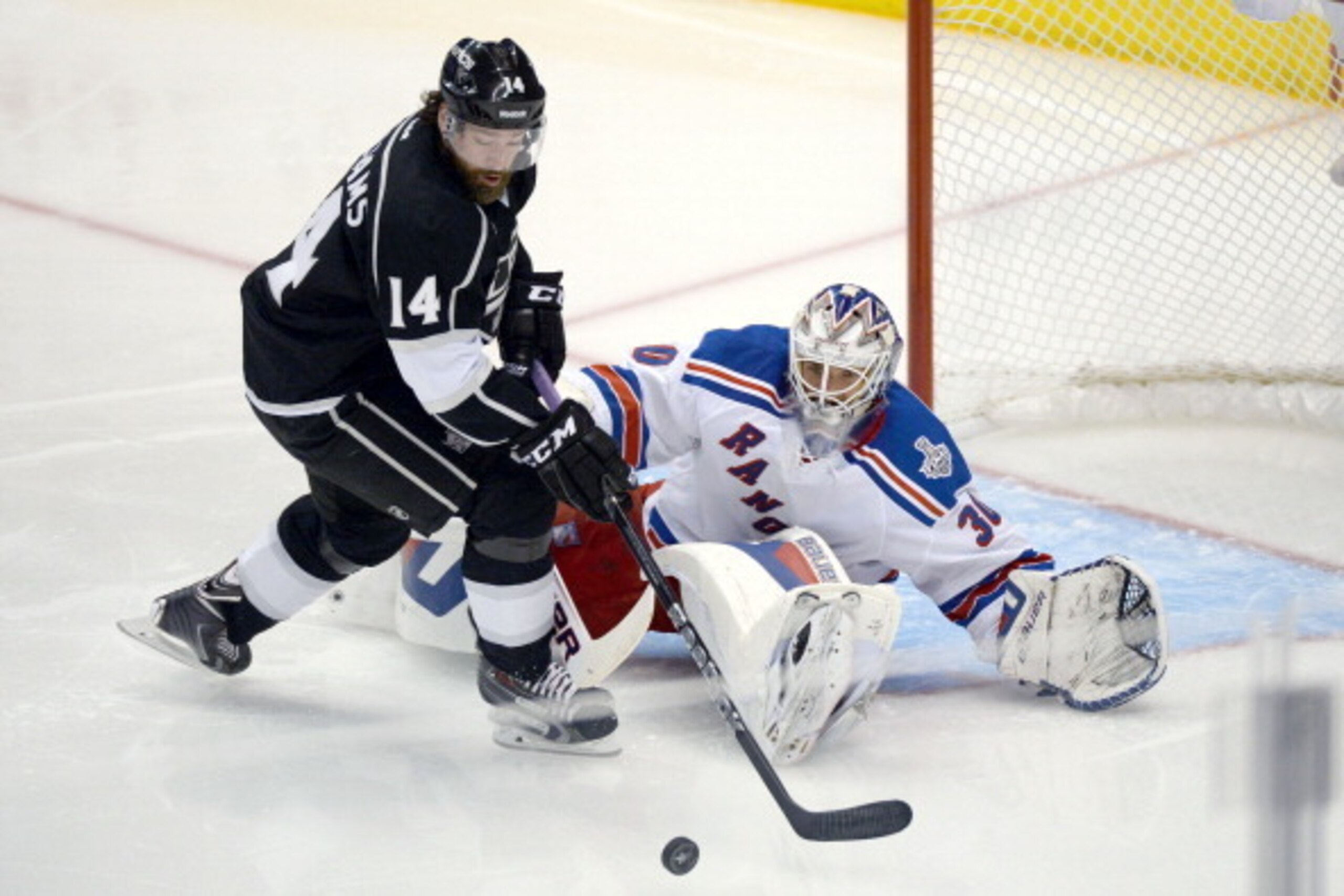 LOS ANGELES, CA - JUNE 7:  Justin Williams #14 of the Los Angeles Kings skates with the puck against Henrik Lundqvist #30 of the New York Rangers during the second period of Game Two of the Stanley Cup Final during the 2014 Stanley Cup Playoffs at Staples