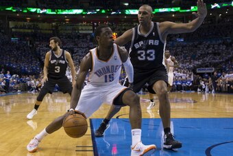 OKLAHOMA CITY, OK - May 27: Reggie Jackson #15 of the Oklahoma City Thunder goes up for the layup against the San Antonio Spurs in Game 4 of the Western Conference Finals during the 2014 NBA Playoffs at the Chesapeake Arena on May 27, 2014 in Oklahoma Cit