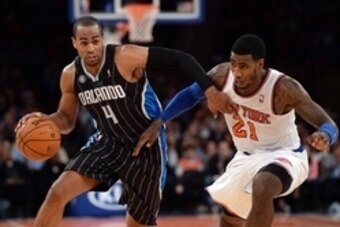 Dec 6, 2013; New York, NY, USA; New York Knicks shooting guard Iman Shumpert (21) guards Orlando Magic shooting guard Arron Afflalo (4) during the first half at Madison Square Garden. The Knicks won the game 121-83. Mandatory Credit: Joe Camporeale-USA TO
