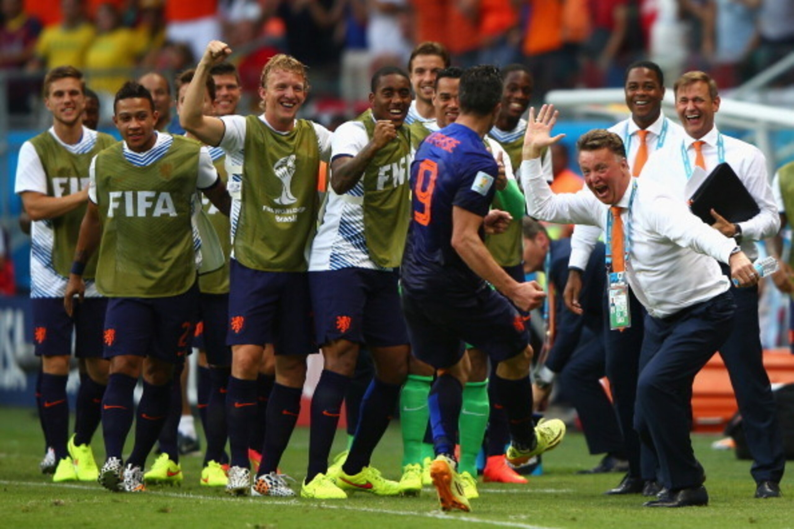 SALVADOR, BRAZIL - JUNE 13: Robin van Persie of the Netherlands (C) celebrates with head coach Louis van Gaal of the Netherlands (R) after scoring the teams first goal in the first half during the 2014 FIFA World Cup Brazil Group B match between Spain an SALVADOR, BRAZIL - JUNE 13: Robin van Persie of the Netherlands (C) celebrates with head coach Louis van Gaal of the Netherlands (R) after scoring the teams first goal in the first half during the 2014 FIFA World Cup Brazil Group B match between Spain an
