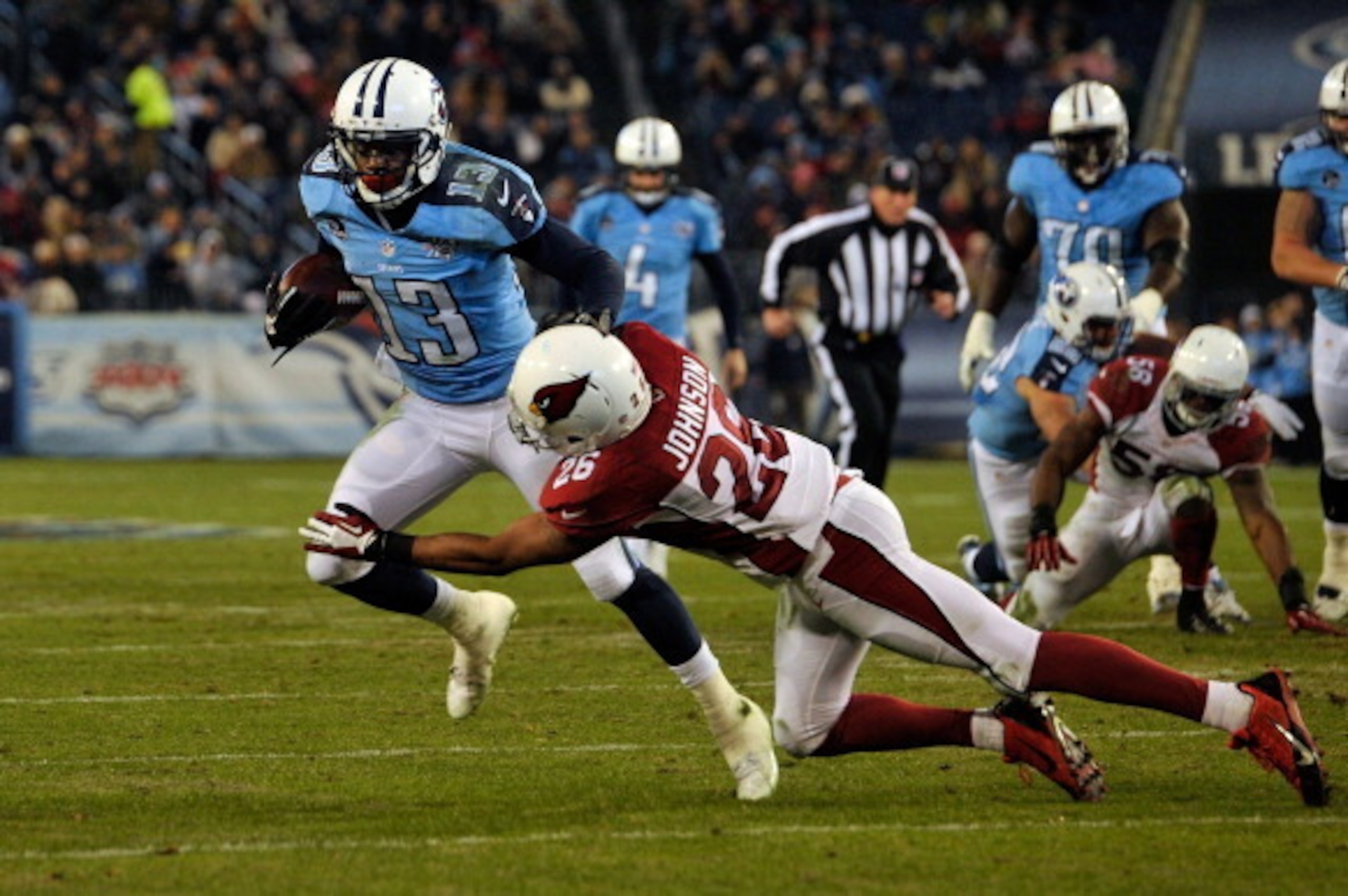 NASHVILLE, TN - DECEMBER 15: Kendall Wright #13 of the Tennessee Titans is tackled by Rashad Johnson #26 of the Arizona Cardinals at LP Field on December 15, 2013 in Nashville, Tennessee. (Photo by Frederick Breedon/Getty Images) NASHVILLE, TN - DECEMBER 15: Kendall Wright #13 of the Tennessee Titans is tackled by Rashad Johnson #26 of the Arizona Cardinals at LP Field on December 15, 2013 in Nashville, Tennessee. (Photo by Frederick Breedon/Getty Images)