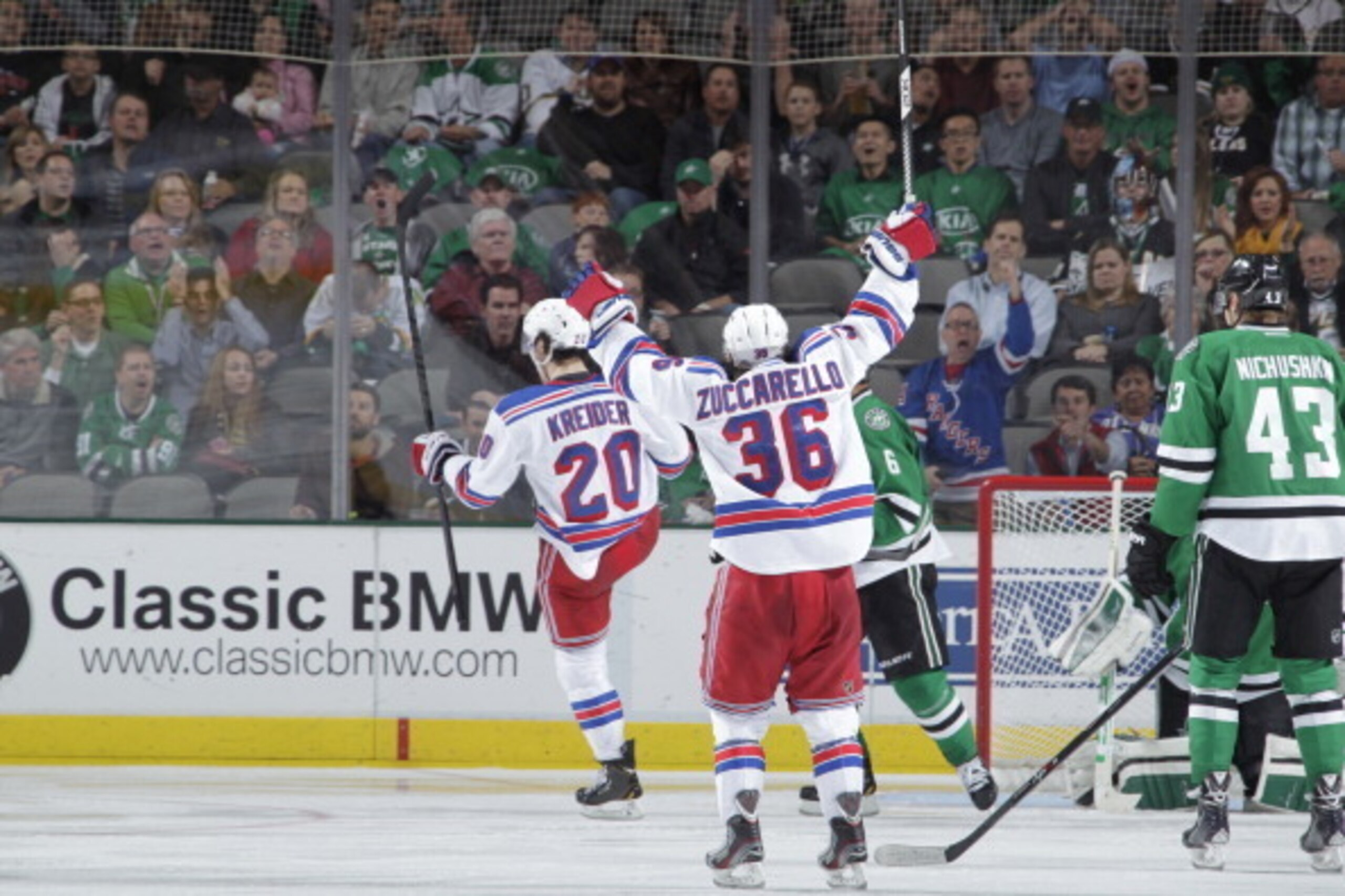DALLAS, TX - NOVEMBER 21:  Mats Zuccarello #36 and Chris Kreider #20 and the New York Rangers celebrate a goal against the Dallas Stars at the American Airlines Center on November 21, 2013 in Dallas, Texas. (Photo by Glenn James/NHLI via Getty Images)