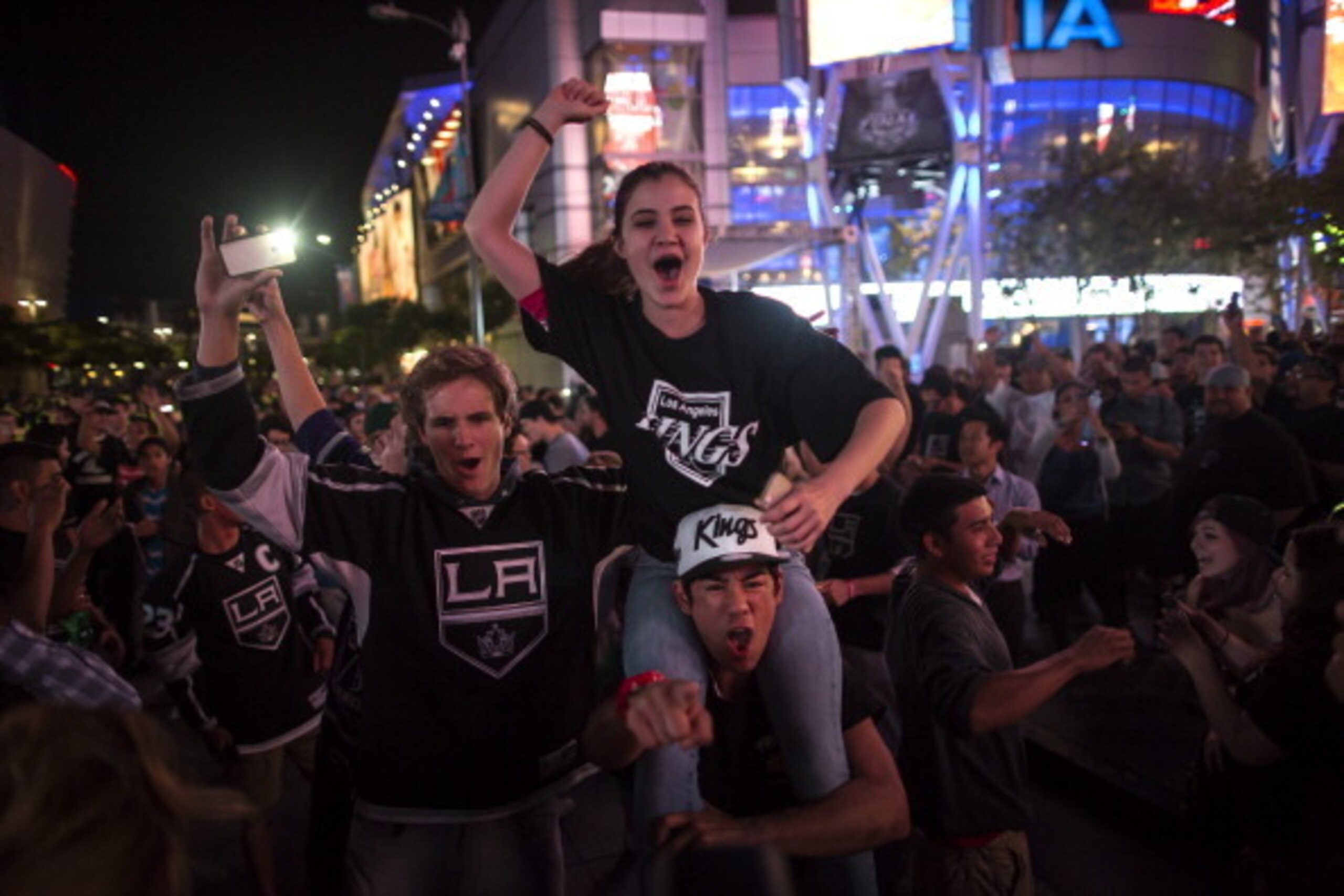 LOS ANGELES, CA - JUNE 13:  Los Angeles Kings fans celebrate the team's Stanley Cup victory in Los Angeles, California. The Kings beat the New York Rangers in overtime. (Photo by Eric Thayer/Getty Images)