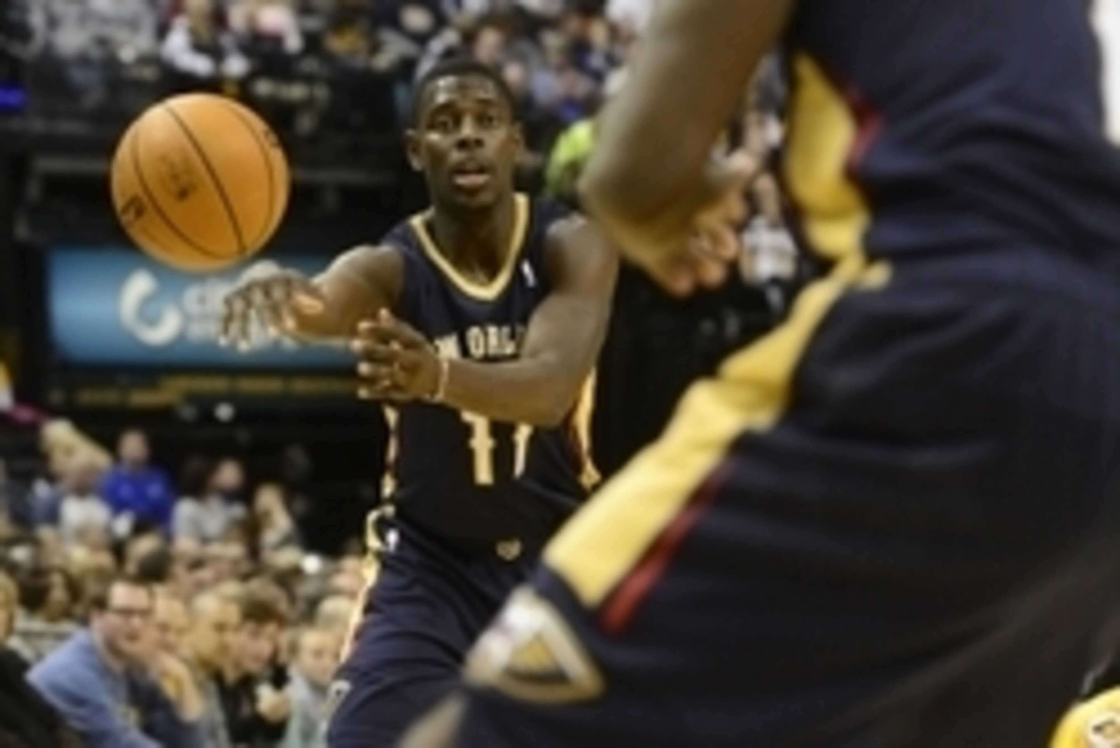 Jan 4, 2014; Indianapolis, IN, USA; New Orleans Pelicans point guard Jrue Holiday (11) passes the ball to New Orleans Pelicans point guard Tyreke Evans (1) during the second half of the game against the Indiana Pacers at Bankers Life Fieldhouse.  Indiana 