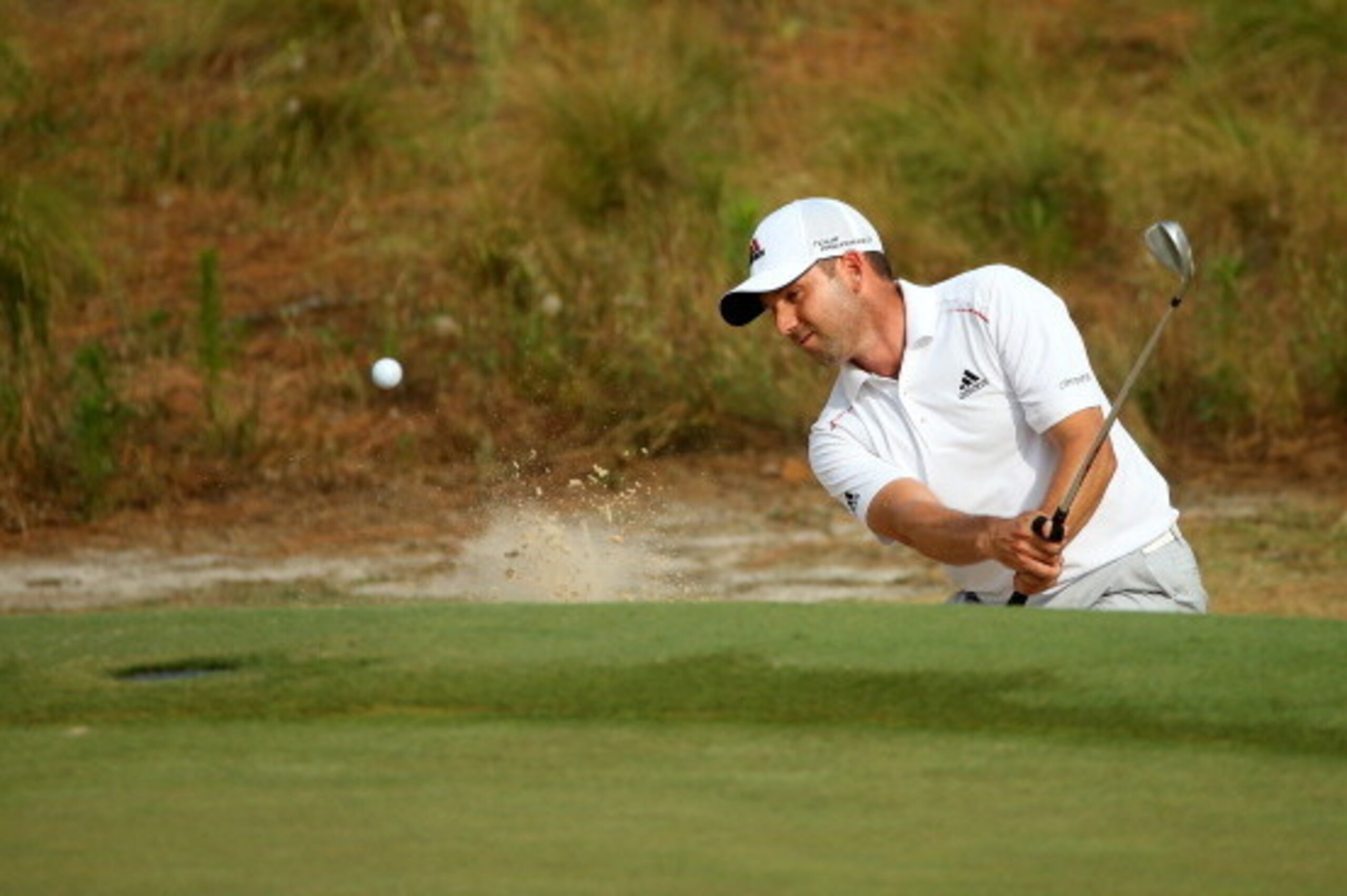 PINEHURST, NC - JUNE 13: Sergio Garcia of Spain hits a shot from a greenside bunker on the seventh hole during the second round of the 114th U.S. Open at Pinehurst Resort & Country Club, Course No. 2 on June 13, 2014 in Pinehurst, North Carolina. (Photo PINEHURST, NC - JUNE 13: Sergio Garcia of Spain hits a shot from a greenside bunker on the seventh hole during the second round of the 114th U.S. Open at Pinehurst Resort & Country Club, Course No. 2 on June 13, 2014 in Pinehurst, North Carolina. (Photo