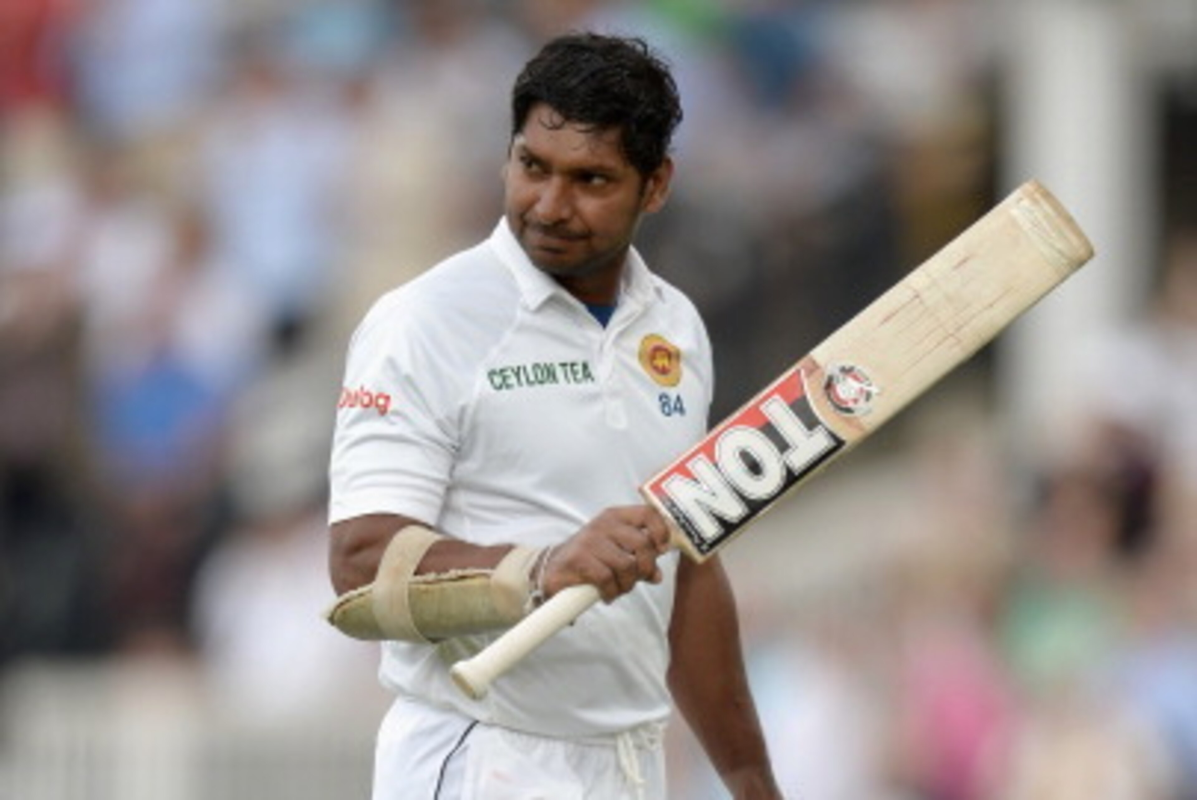 LONDON, ENGLAND - JUNE 14:  Kumar Sangakkara of Sri Lanka leaves the field after being dismissed by Moeen Ali of England during day three of 1st Investec Test match between England and Sri Lanka at Lord's Cricket Ground on June 14, 2014 in London, England