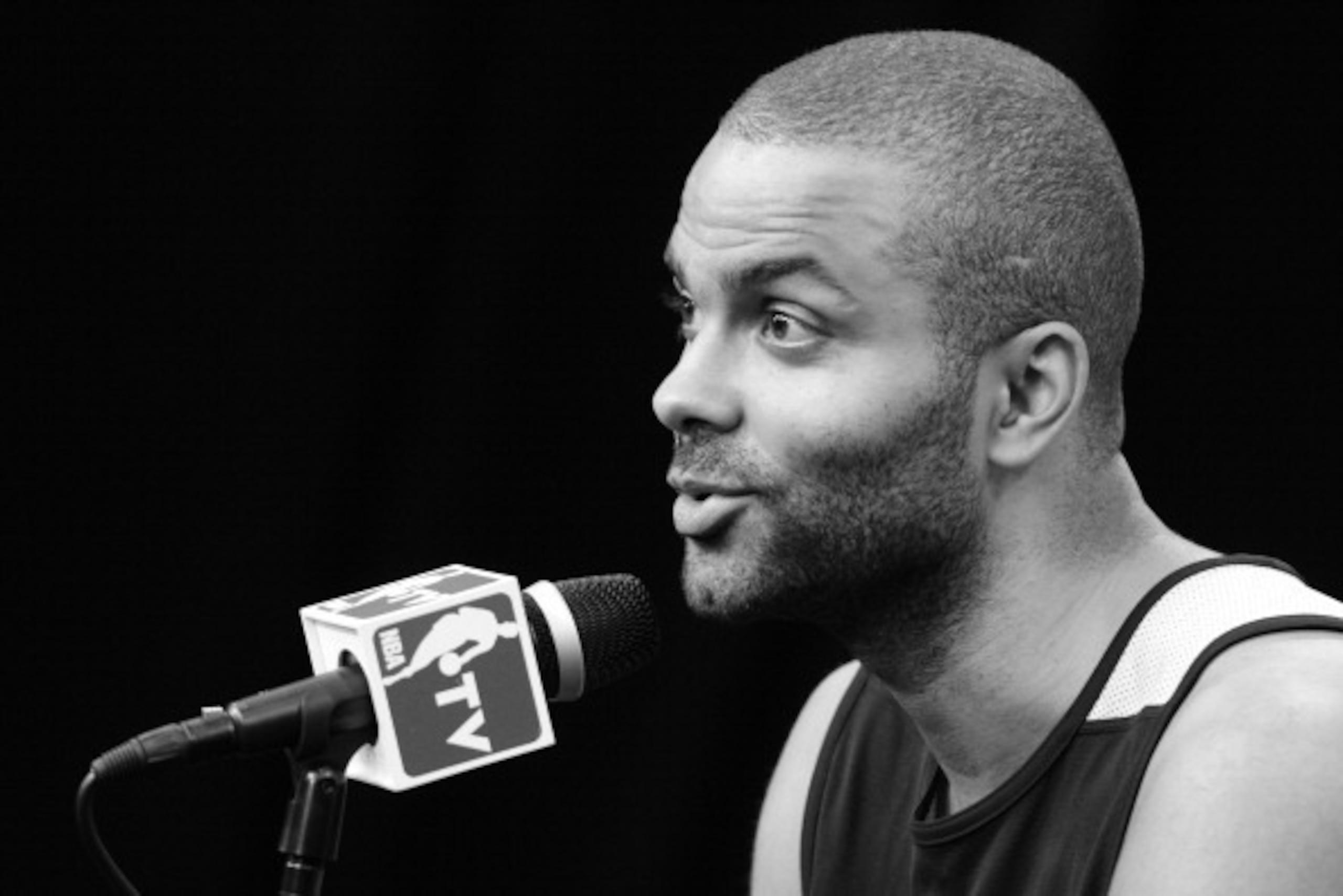 SAN ANTONIO, TX - JUNE 14: ***Shot in Black and White*** Tony Parker #9 of the San Antonio Spurs speaks to the media during practice and media availability as part of the 2014 NBA Finals on June 14, 2014 at the Spurs Practice Facility in San Antonio, Texa