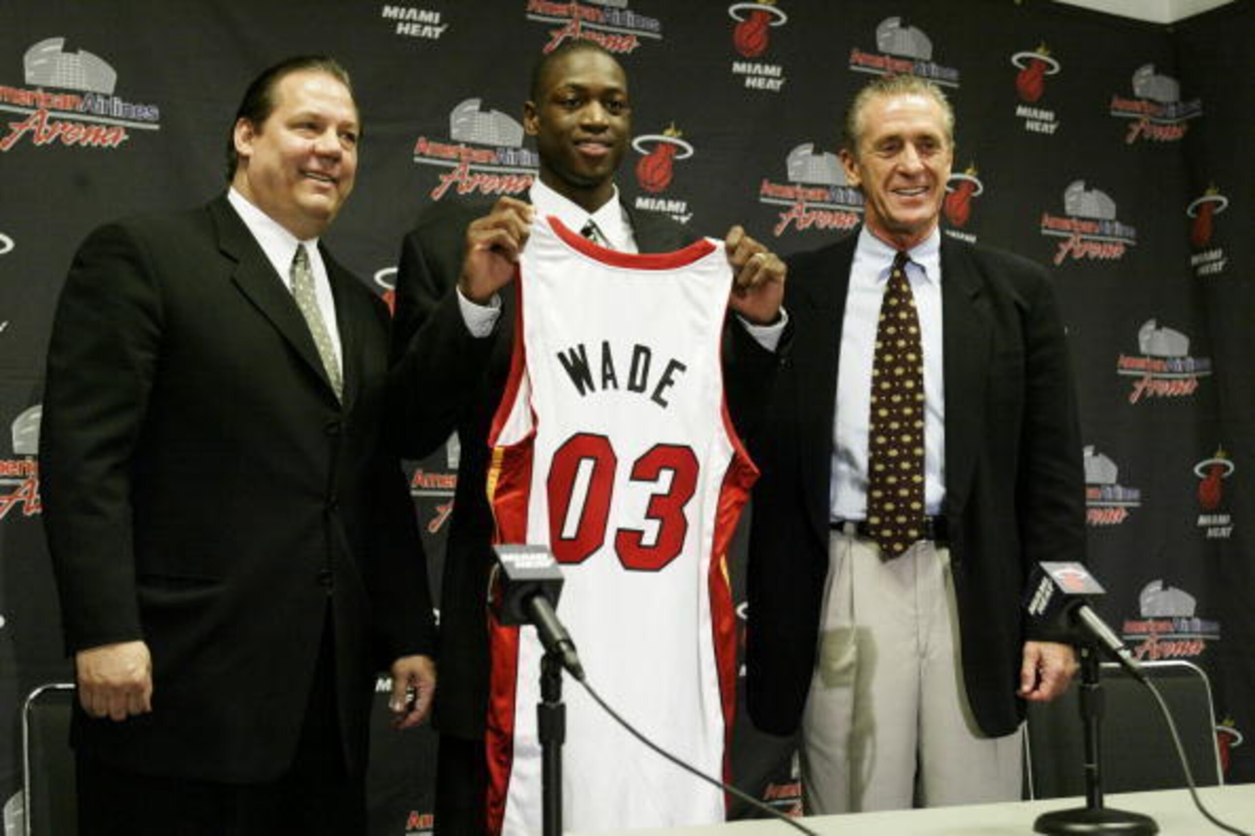 MIAMI - JUNE 27:  (L to R) Randy Pfund, Dwyane Tyrone Wade and Pat Riley attend the Miami Heat press conference to present the Heat's #5 draft pick on June 27, 2003 at American Airlines Arena in Miami, Florida. NOTE TO USER: User expressly acknowledges an