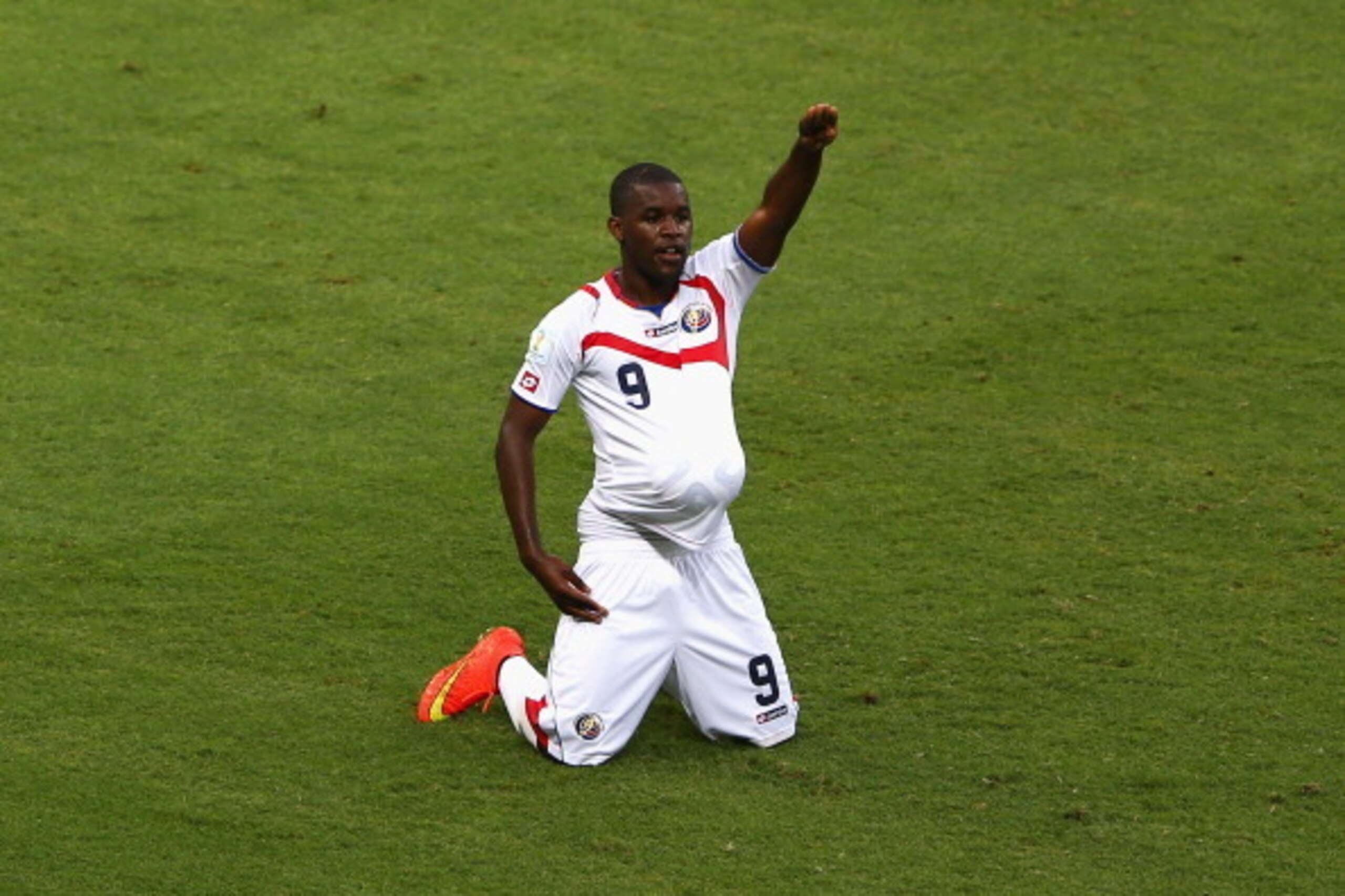 FORTALEZA, BRAZIL - JUNE 14:  Joel Campbell of Costa Rica celebrates scoring his team's first goal with the ball under his jersey during the 2014 FIFA World Cup Brazil Group D match between Uruguay and Costa Rica at Castelao on June 14, 2014 in Fortaleza,