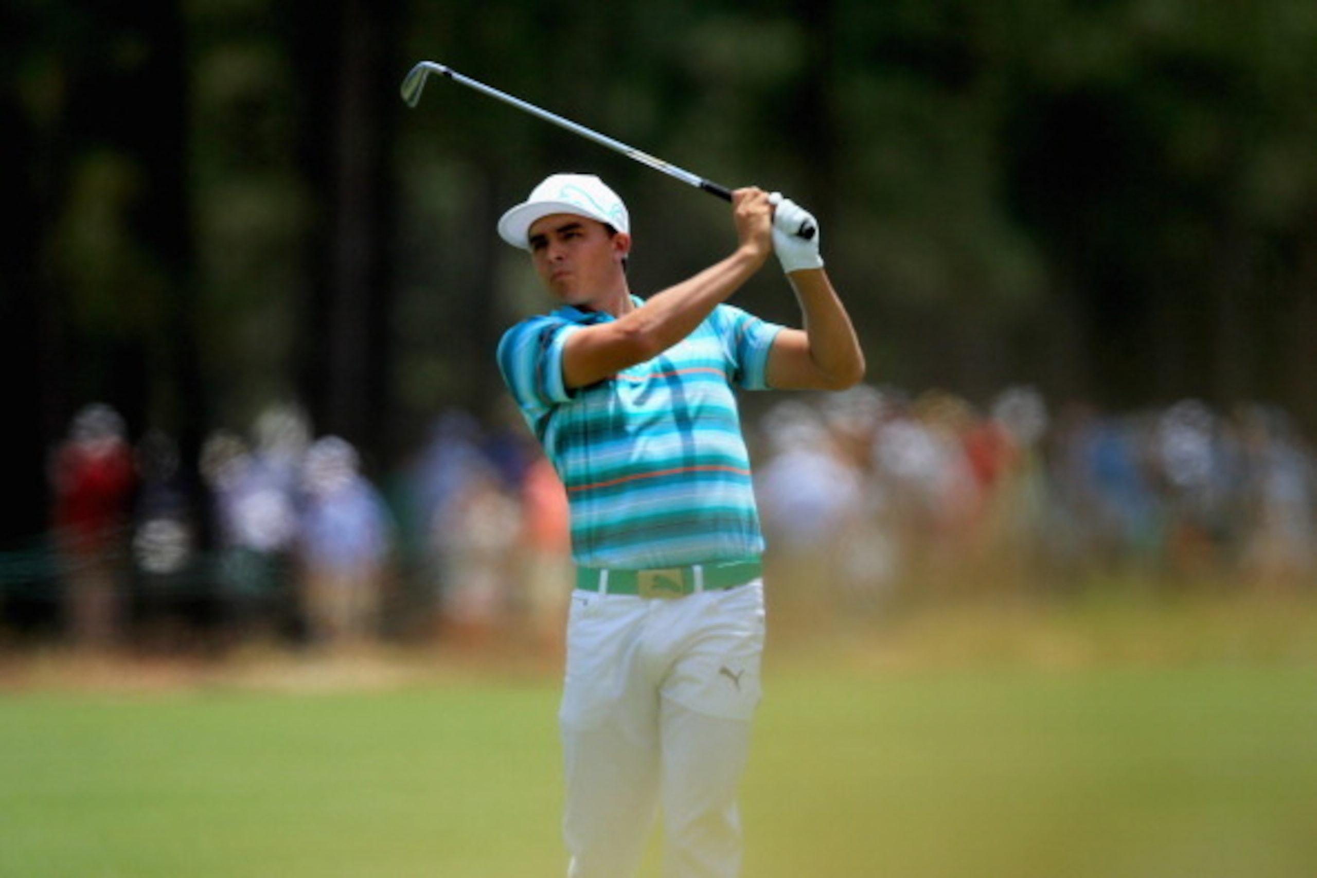 PINEHURST, NC - JUNE 14:  Rickie Fowler of the United States hits an approach shot on the second hole during the third round of the 114th U.S. Open at Pinehurst Resort & Country Club, Course No. 2 on June 14, 2014 in Pinehurst, North Carolina.  (Photo by 