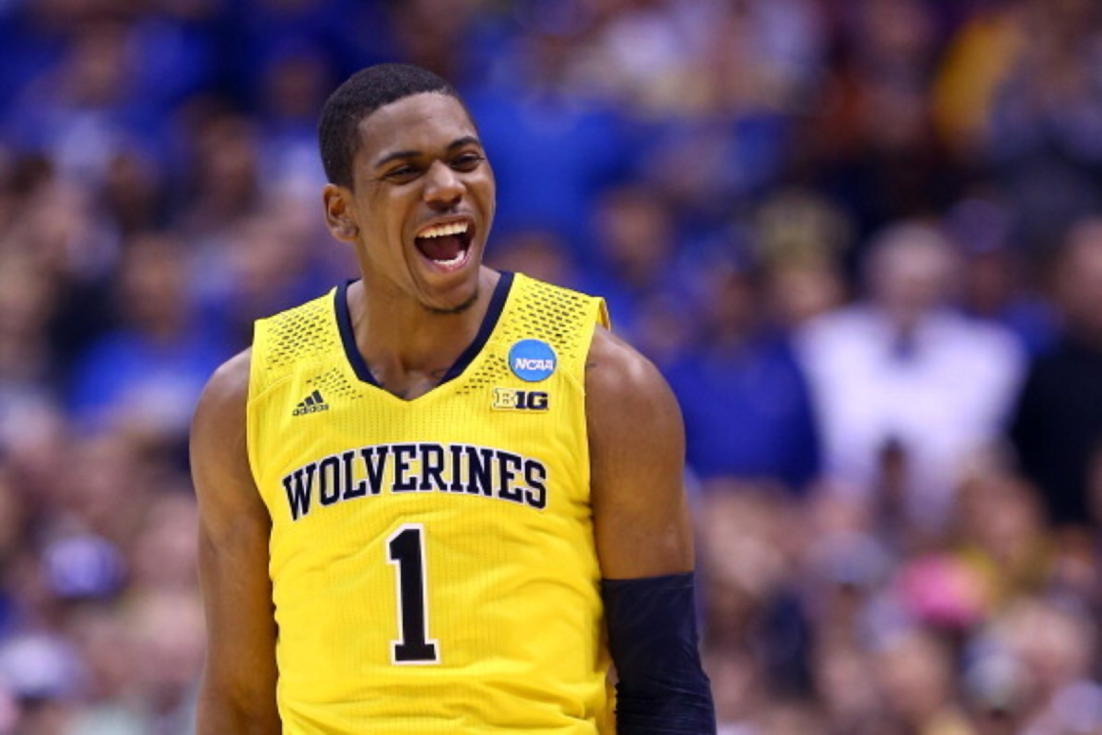 INDIANAPOLIS, IN - MARCH 30: Glenn Robinson III #1 of the Michigan Wolverines celebrates after a basket in the second half against the Kentucky Wildcats during the midwest regional final of the 2014 NCAA Men's Basketball Tournament at Lucas Oil Stadium o INDIANAPOLIS, IN - MARCH 30: Glenn Robinson III #1 of the Michigan Wolverines celebrates after a basket in the second half against the Kentucky Wildcats during the midwest regional final of the 2014 NCAA Men's Basketball Tournament at Lucas Oil Stadium o