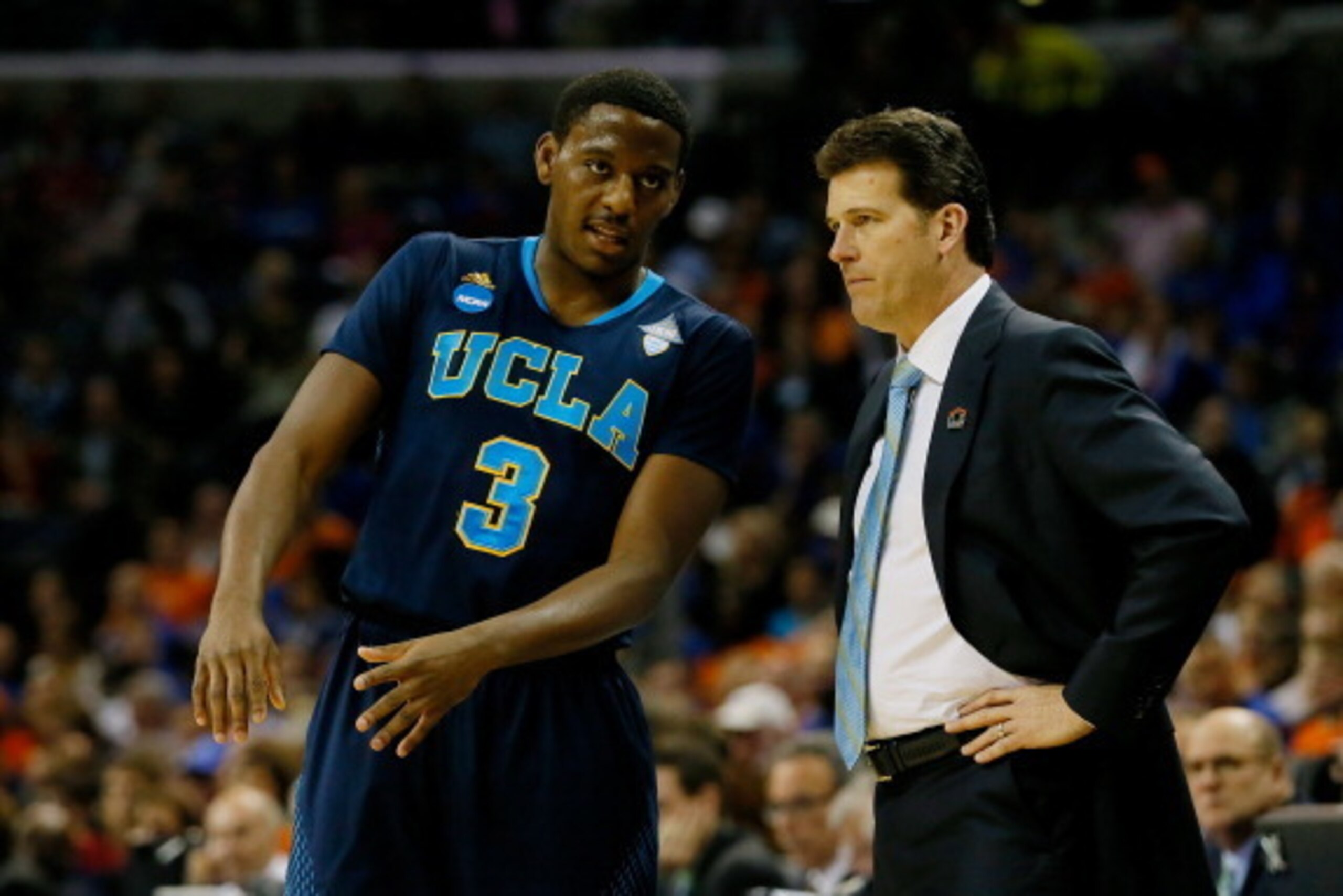 MEMPHIS, TN - MARCH 27: Head coach Steve Alford speaks with Jordan Adams #3 of the UCLA Bruins during a regional semifinal of the 2014 NCAA Men's Basketball Tournament against the Florida Gators at the FedExForum on March 27, 2014 in Memphis, Tennessee.  