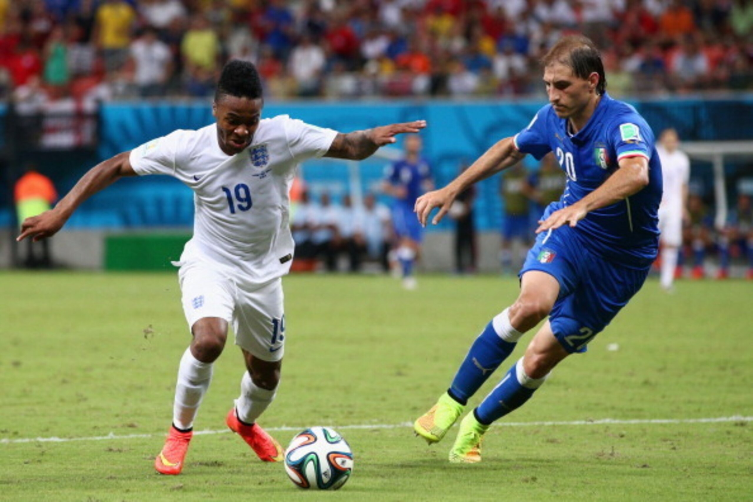 MANAUS, BRAZIL - JUNE 14: Raheem Sterling of England controls the ball against Gabriel Paletta of Italy during the 2014 FIFA World Cup Brazil Group D match between England and Italy at Arena Amazonia on June 14, 2014 in Manaus, Brazil.  (Photo by Adam Pre