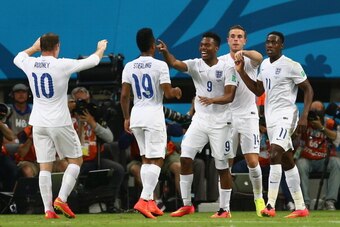 MANAUS, BRAZIL - JUNE 14: Daniel Sturridge of England (C) celebrates scoring his team's first goal with Wayne Rooney (L), Raheem Sterling (2nd L), Jordan Henderson (2nd R) and Danny Welbeck (R) during the 2014 FIFA World Cup Brazil Group D match between E