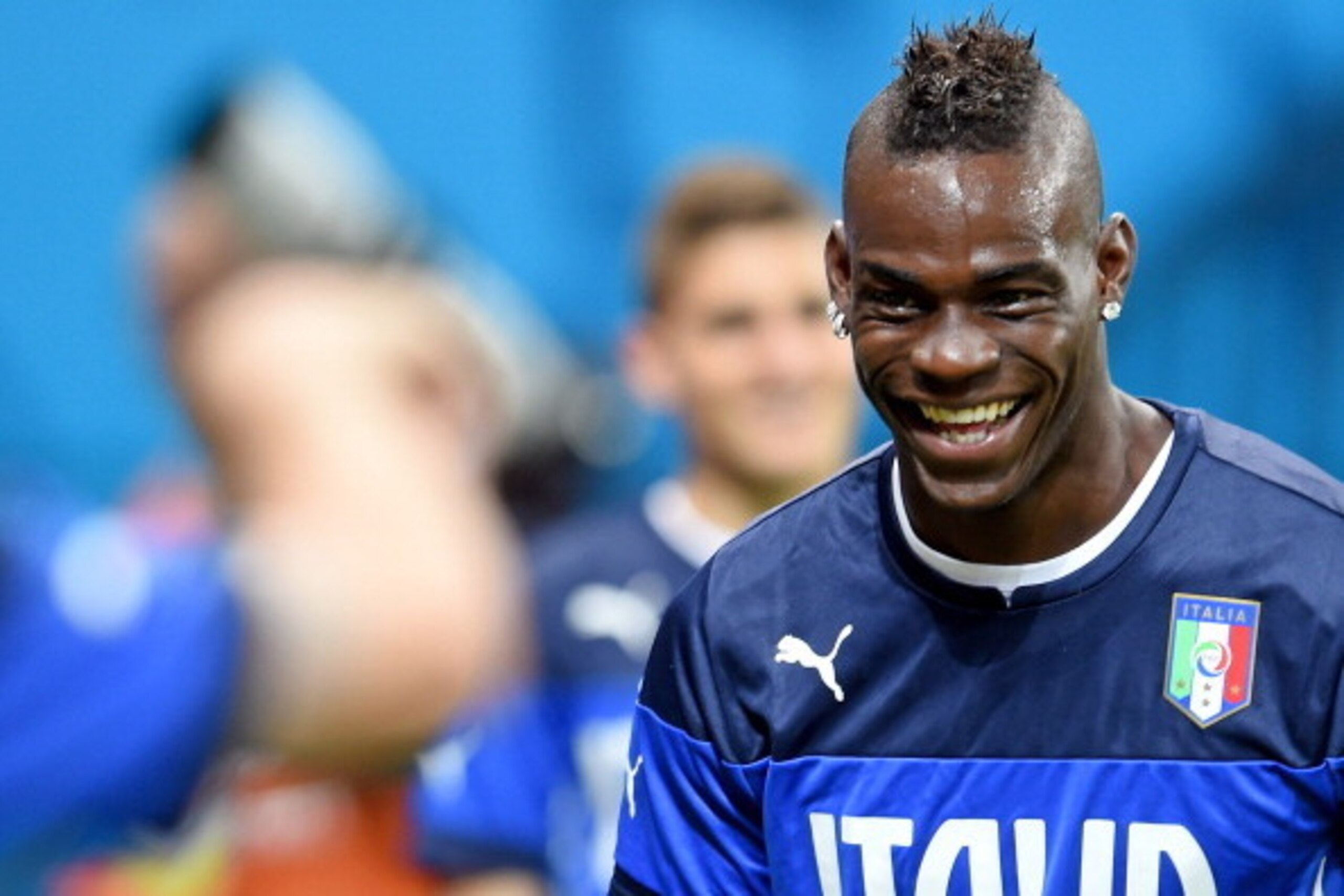 MANAUS, BRAZIL - JUNE 13:  Mario Balotelli smiles during an Italy training session at the Arena Amazonia on June 13, 2014 in Manaus, Brazil. Italy will play England in their opening group D match on June 14, 2014 in Manaus, Brazil.  (Photo by Claudio Vill